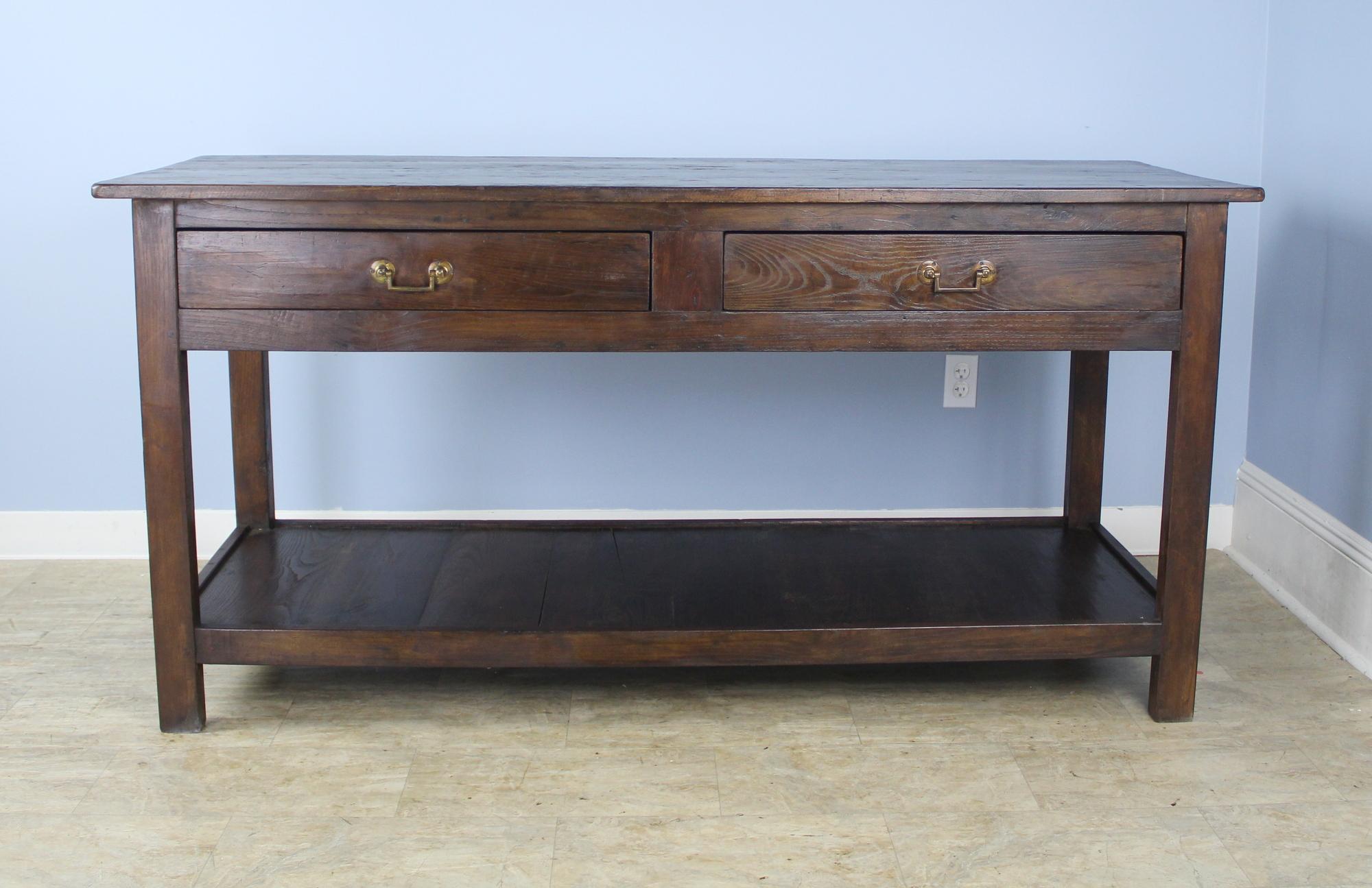 A fabulous French chestnut and fruitwood draper's table, originally for use by a tailor or seamstress. This particular one made more useful by having two drawers on either side for a similar look coming from either direction, as shown in images 2