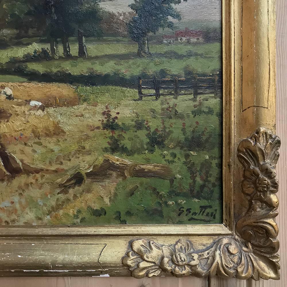 Antique framed Country French oil landscape painting on board by by S.Suttiers is a splendid and vibrant landscape with the wheat harvest depicted in the foreground. Many French people believe and possibly rightly so, that their country was blessed