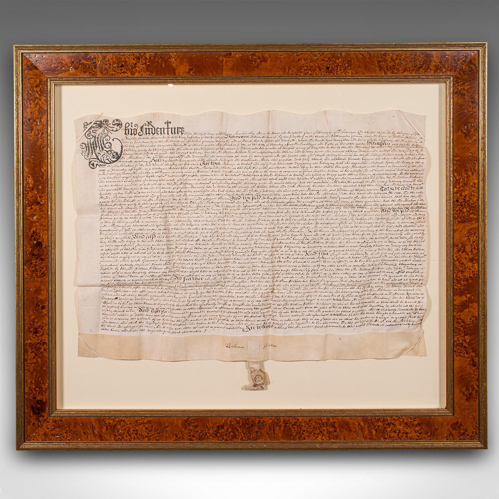 This is an antique framed indenture. An English, vellum document in modern frame, dating to the 17th century and later, dated to 1671.

Issued in three parts, indentures were legal documents cut with wavy edges, meaning two copies could be matched