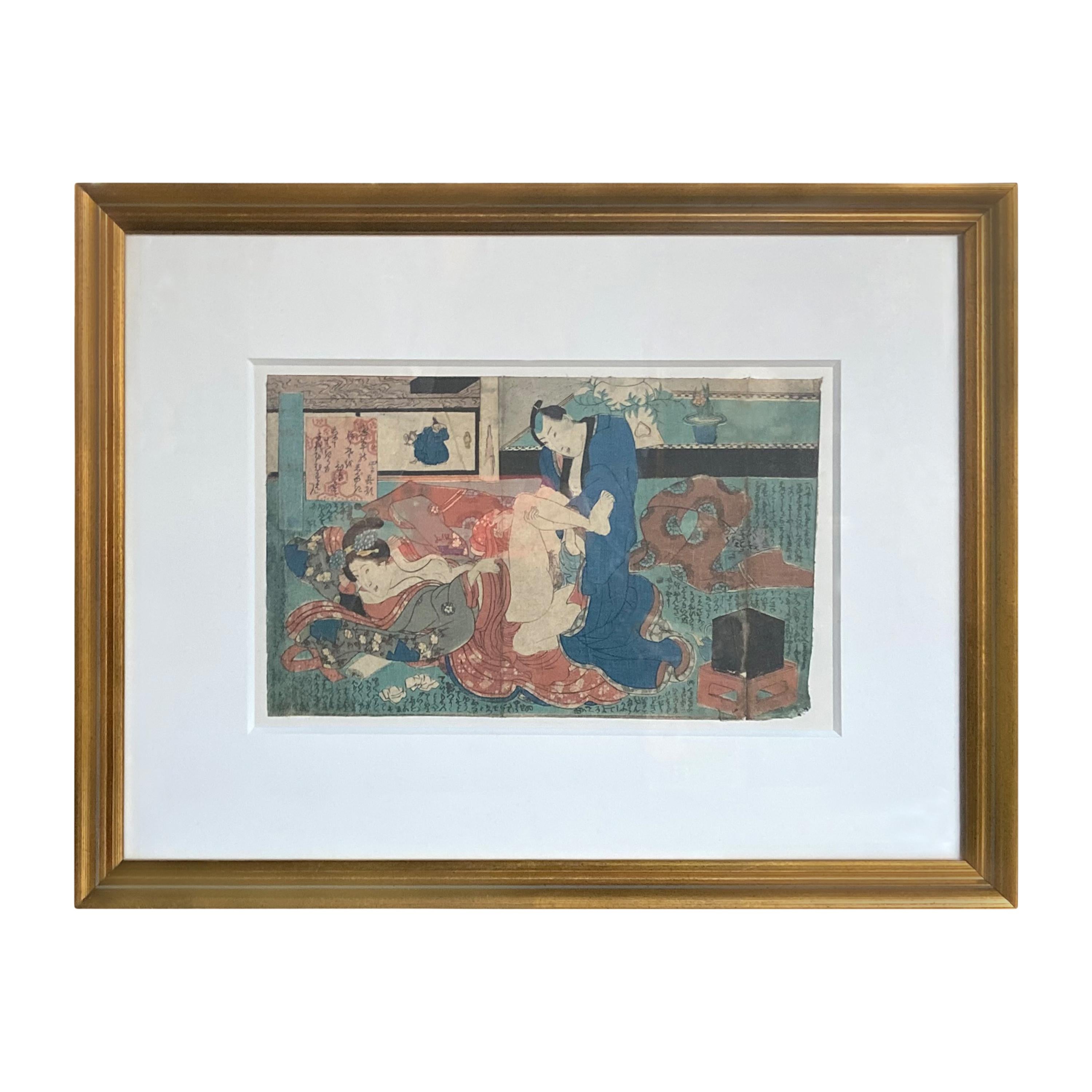 An antique Japanese Shunga woodblock print in gilt frame depicting a man and a woman making love. Created in Japan, this woodblock print called a Shunga and depicting a couple making love, derives from an erotic artistic tradition featuring graphic