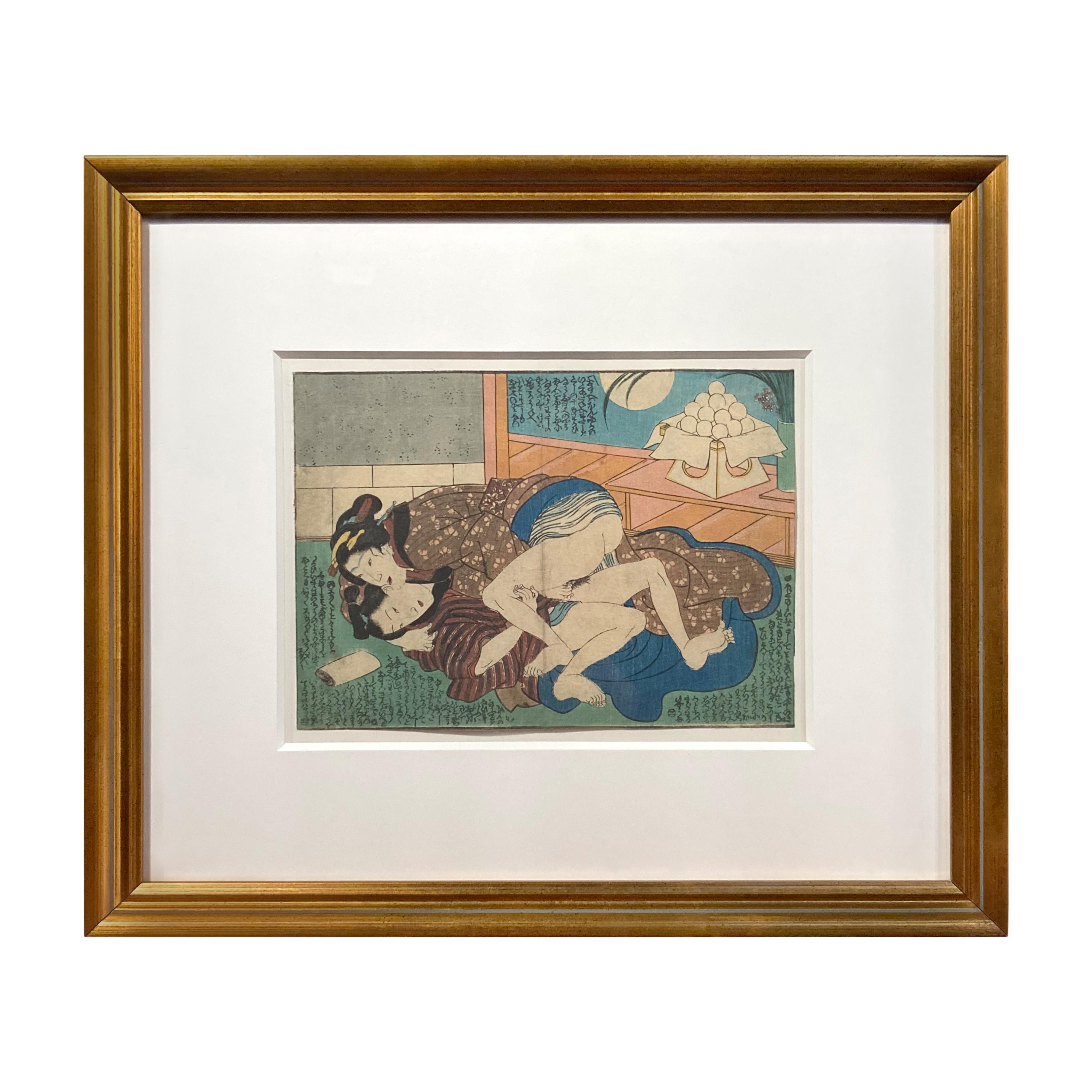 An antique Japanese Shunga woodblock print in gilt frame depicting two women making love. Created in Japan, this woodblock print called a Shunga and depicting two women making love, derives from an erotic artistic tradition featuring graphic images