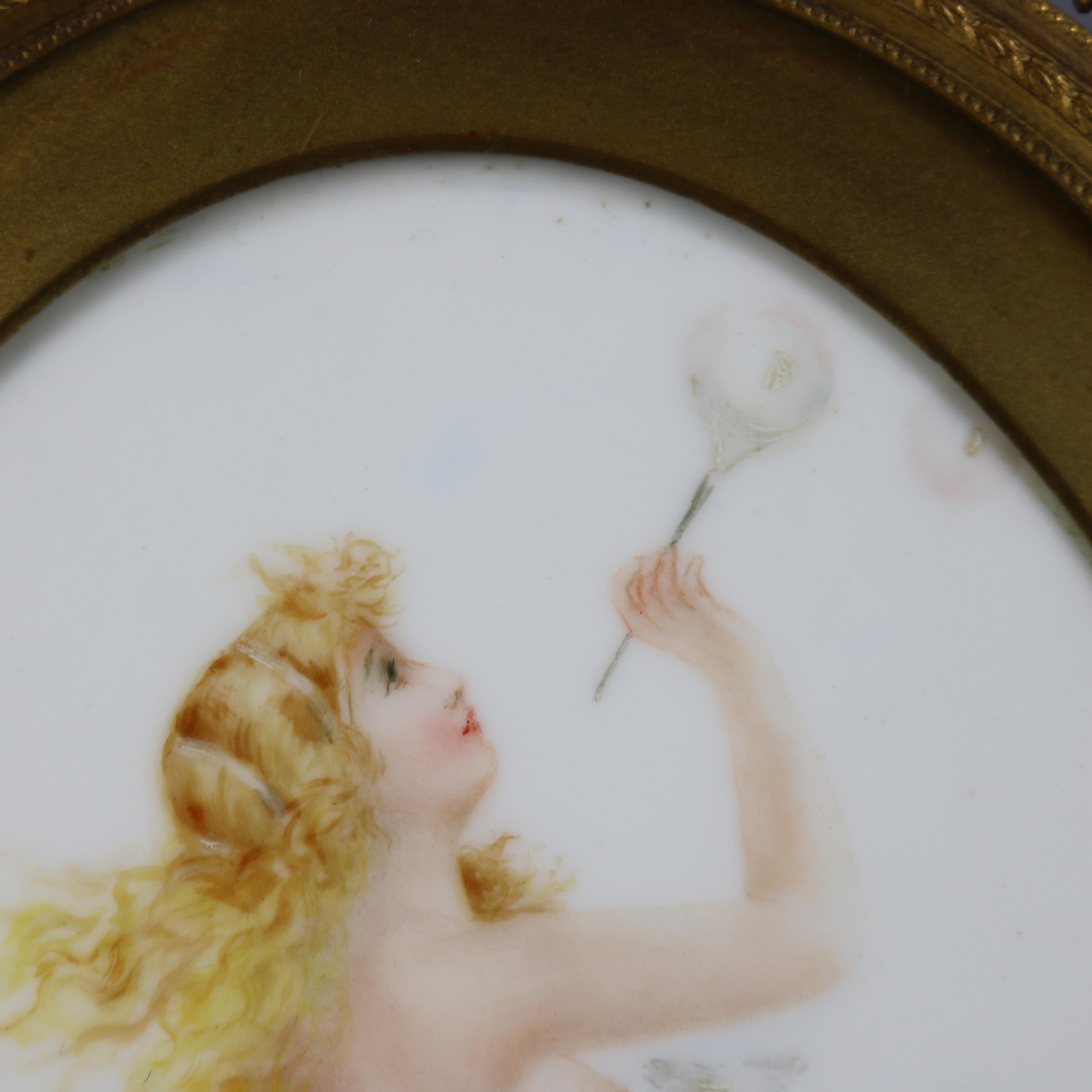 An antique mixed-media painting on porcelain in the manner of KPM depicts partially nude woman in countryside setting blowing bubbles, seated in gilt frame, circa 1890

Measures: 9.75