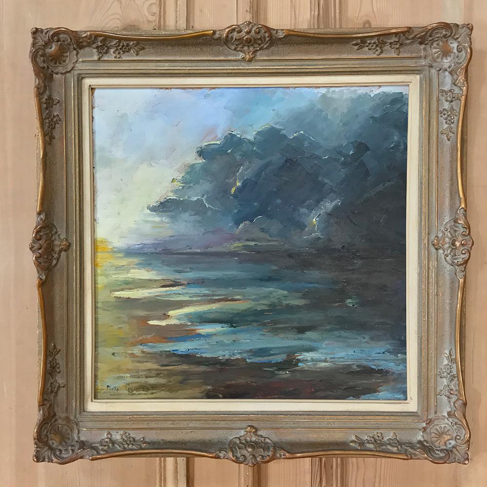 Atique Framed Landscape Oil Painting on Canvas by Miton Geirnaert (born 1908) is a celebration of the power of nature, with a storm moving ashore. Here the artist has used a broad range of colors to depict the event, capturing the imagination and