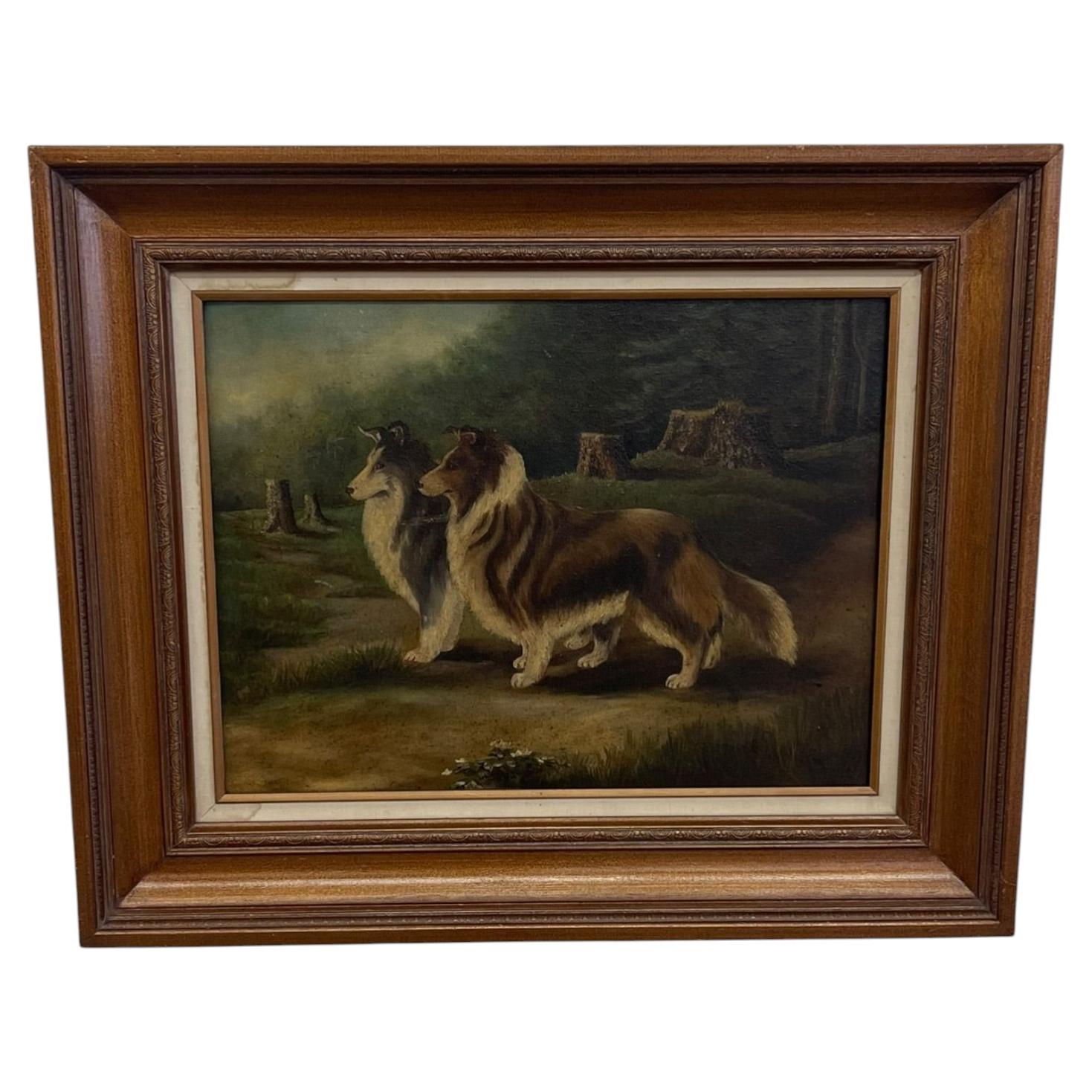 Cuadro antiguo al óleo, enmarcado, que representa a dos perros collie en un paisaje boscoso.