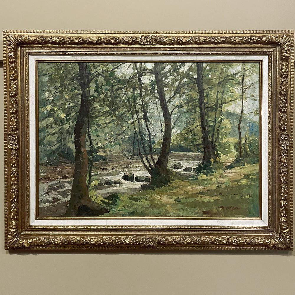 Antique framed oil painting on canvas by Jean Matthieu Jamsin (1882-1965) is a classic example of the pastoral work wherein the artist has been captivated by a particularly beautiful woodland scene alongside a rock-strewn creek. The naturalistic
