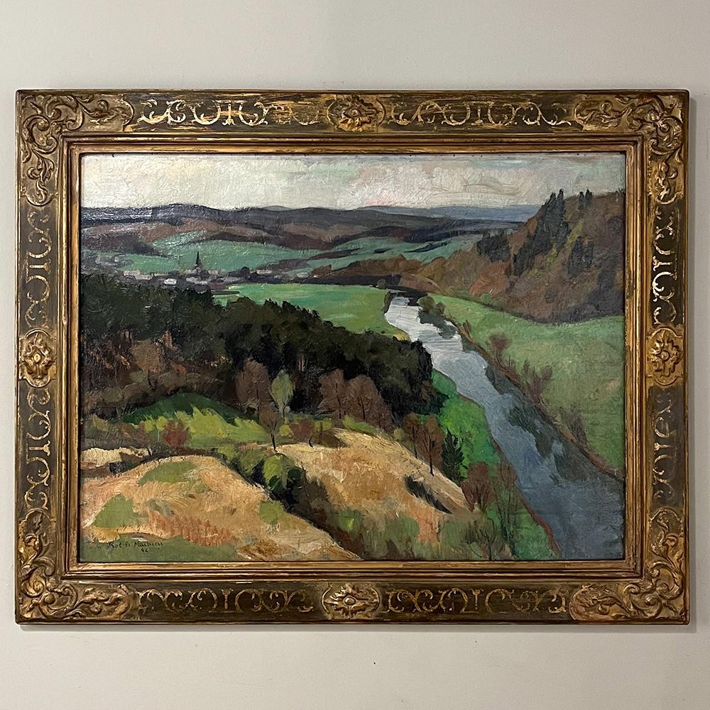 Antique framed oil painting on canvas by Pol-Francois Mathieu (1895-1979) is a remarkable work by the artist showcasing his landscape skills with a panoramic view of a lush valley with a quaint village as seen from a high vantage point along the