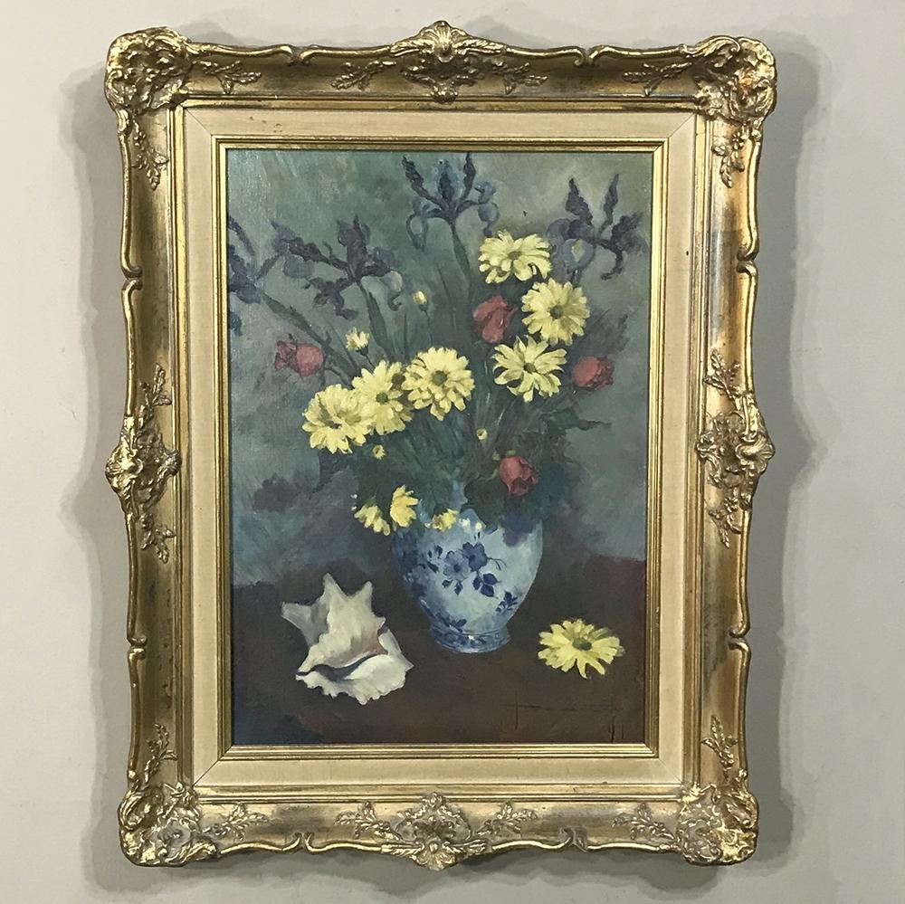 Antique framed oil painting on canvas is a classic take on the timeless Still Life of a bouquet of flowers. The artist has utilized a colorful palette that has been expertly blended to create a subtle vivaciousness. Survives in its original