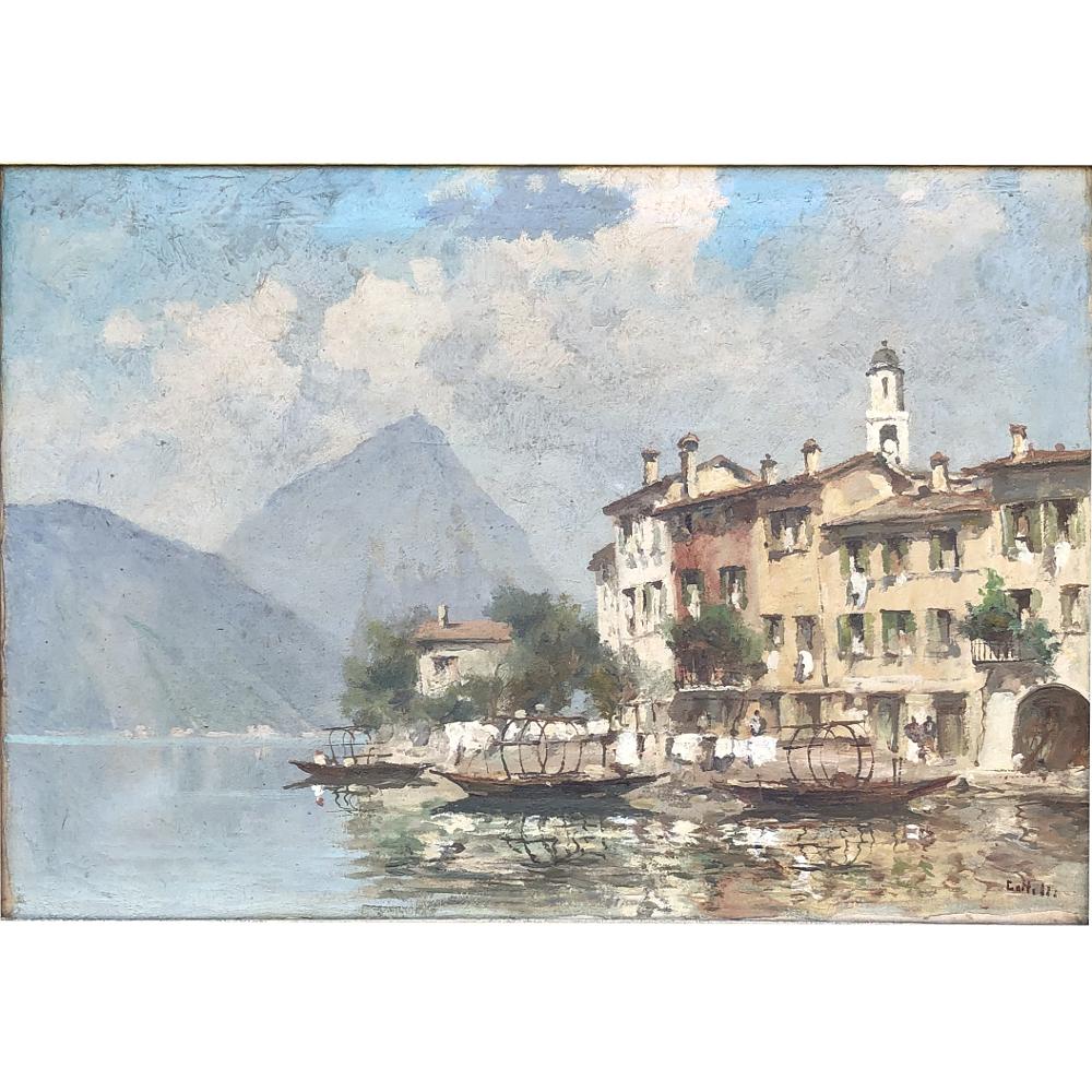 Antique Framed Oil Painting on Canvas is a superlative seaside scene where the artist has skillfully represented a cityscape, mountainous landscape with exquisite sky in the background, all set on a water feature. Survives in its original