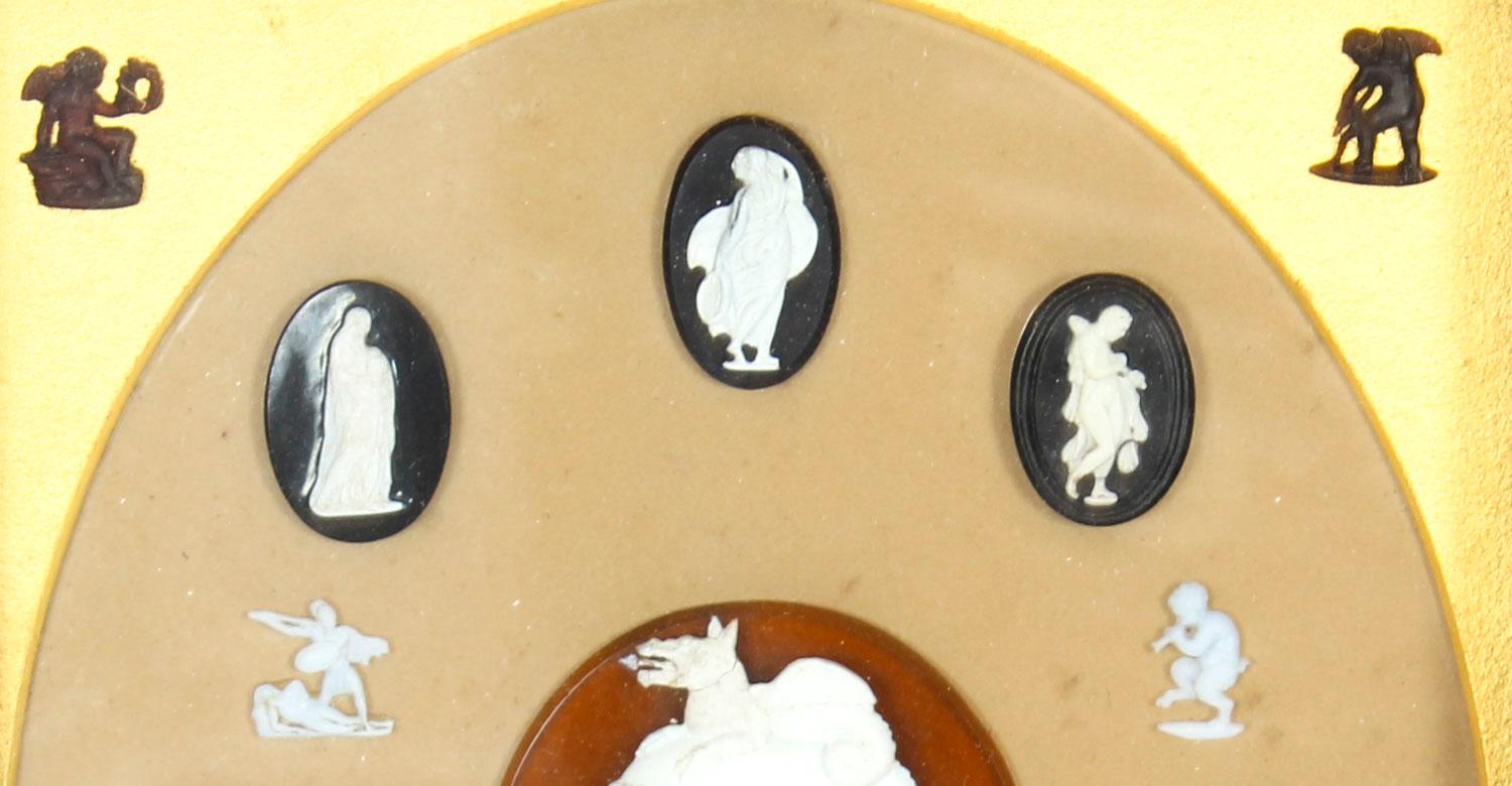 A fine group of Grand Tour gem cameo intaglios mounted in a glazed frame, in the manner of James Tassie, of various historical figures dating from the 19th century.

The intaglios are beautifully mounted on the gilt inner oval frame with a light