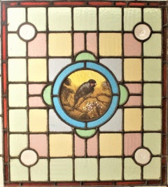 Antique Framed Victorian Stained Glass Window with a Hand Painted Bird Medallion