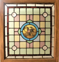 Antique Framed Victorian Stained Glass Window with a Hand Painted Bird Medallion
