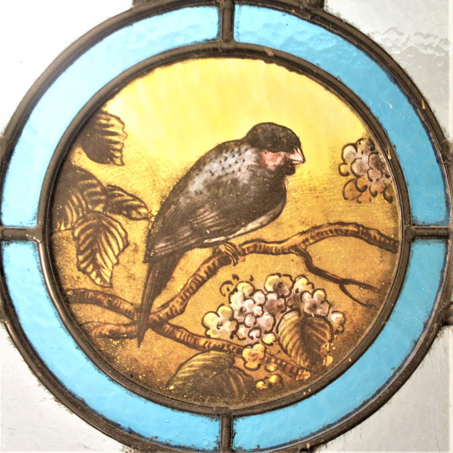 Hand-Crafted Antique Framed Victorian Stained Glass Window with a Hand Painted Bird Medallion