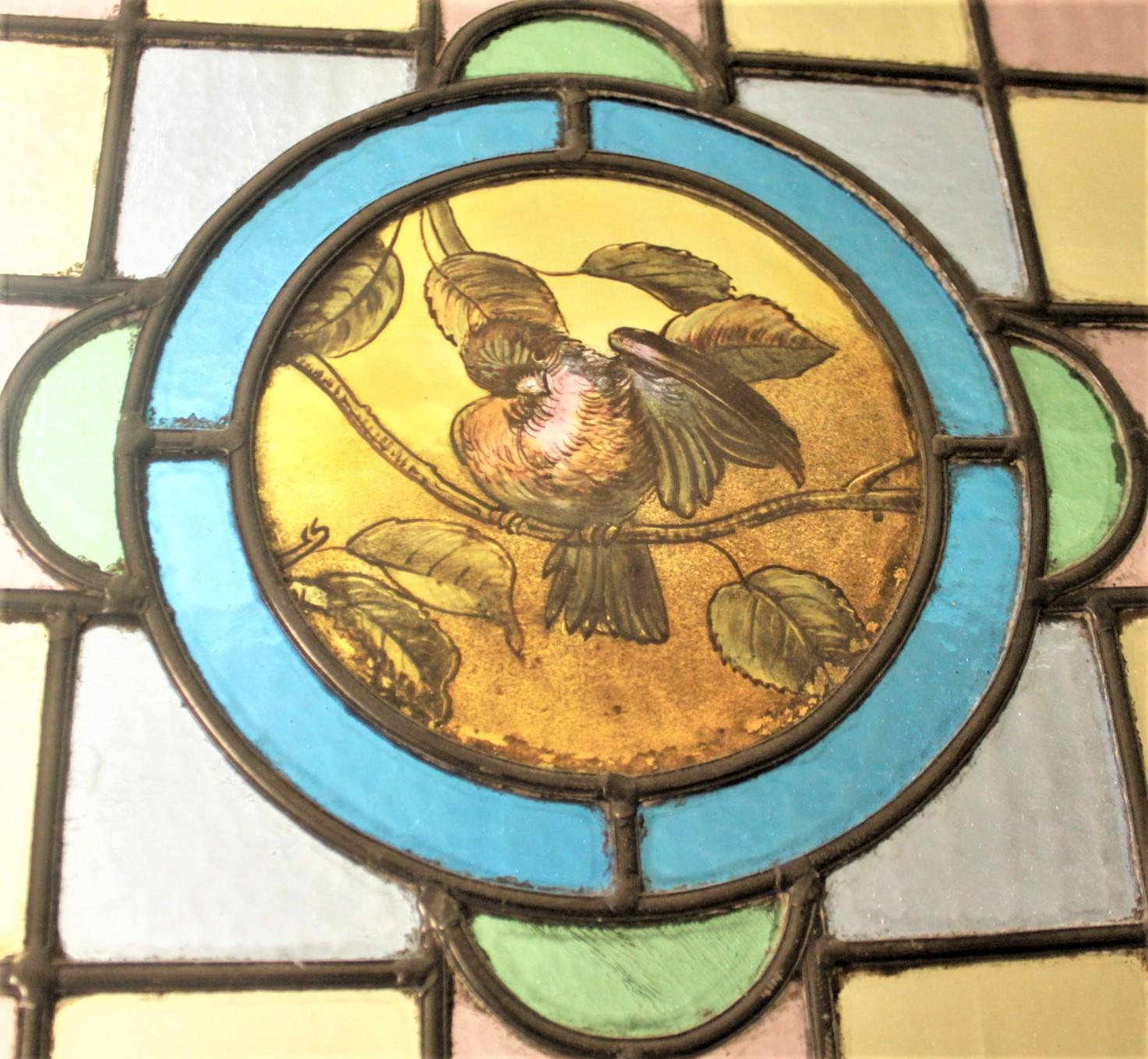 High Victorian Antique Framed Victorian Stained Glass Window with a Hand Painted Bird Medallion