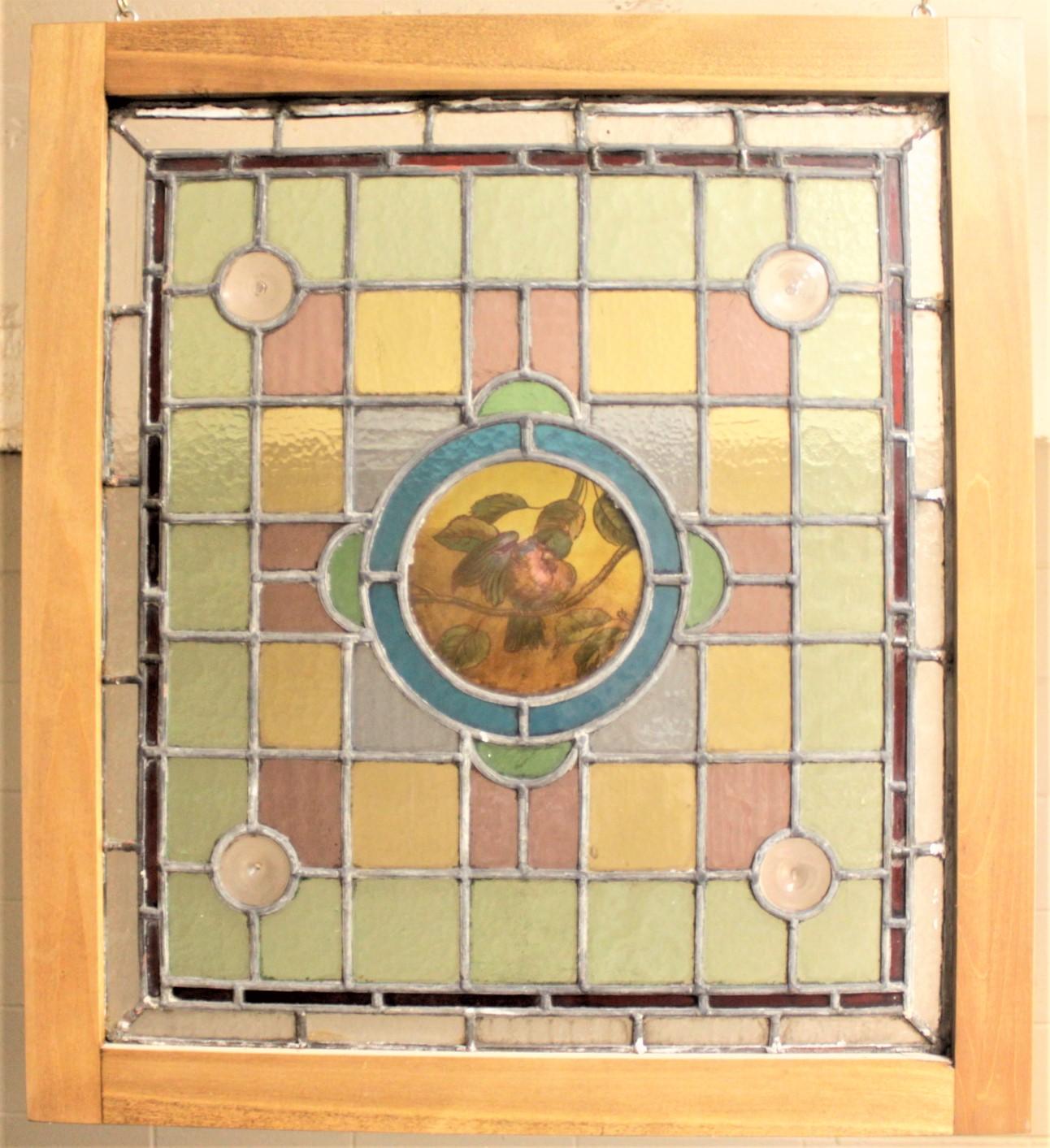 Hand-Crafted Antique Framed Victorian Stained Glass Window with a Hand Painted Bird Medallion