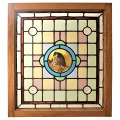 Antique Framed Victorian Stained Glass Window with a Hand Painted Bird Medallion