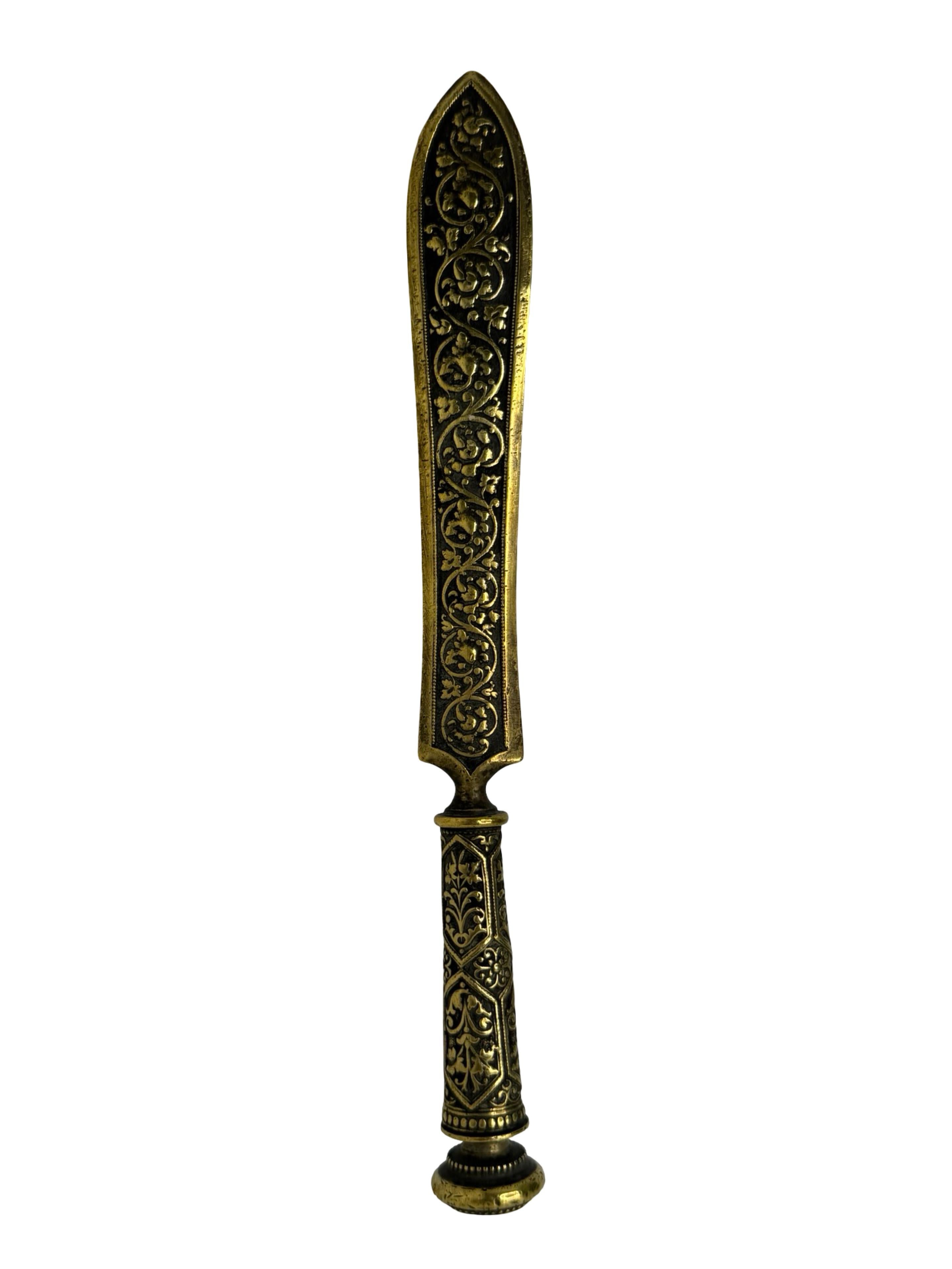 A beautiful antique bronze letter opener dating to the 1900s or earlier, crafted by an unknown sculptor. This beautiful Art Nouveau piece displays graceful, flowing lines and subtle sculptural details characteristic of the period, offering a refined