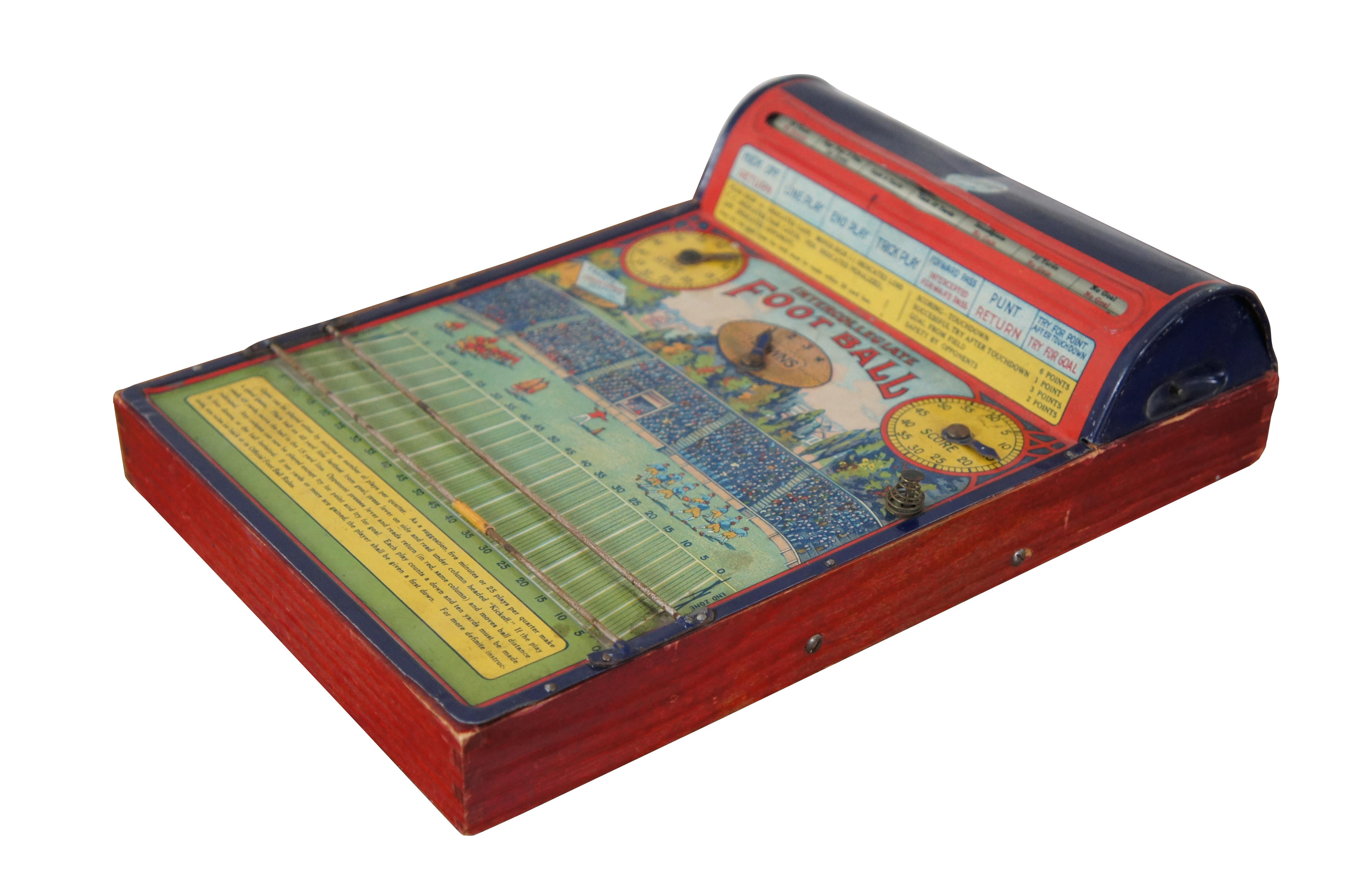 Antique 1920’s Intercollegiate Football table top spinner game by Frantz Manufacturing Company of Sterling, Illinois. Tin body on a wooden base frame, with lithograph printed details and instructions. Mechanism that spins the play wheel is