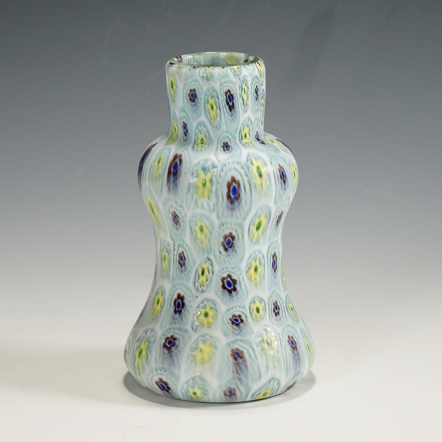 A double pumpkin shaped murrine glass vase, manufactured by Vetreria Fratelli Toso around 1910. The vase is executed with polychrome multicoloured millefiori murrines arranged in vertical rows and has a acid etched matte finish. An authentic example