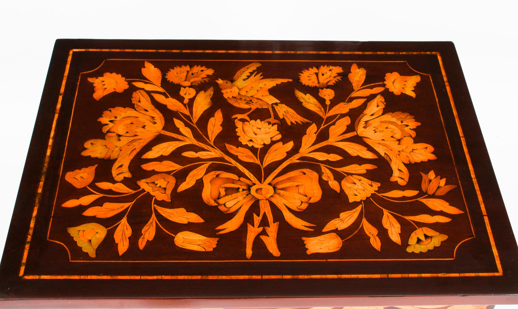 This is a stunning antique early 19th Century Dutch floral marquetry side cabinet, circa 1820 in date.

This splendid cabinet has been accomplished in striking mahogany. The top decorated with a plethora of exquisite hand cut marquetry of bird,