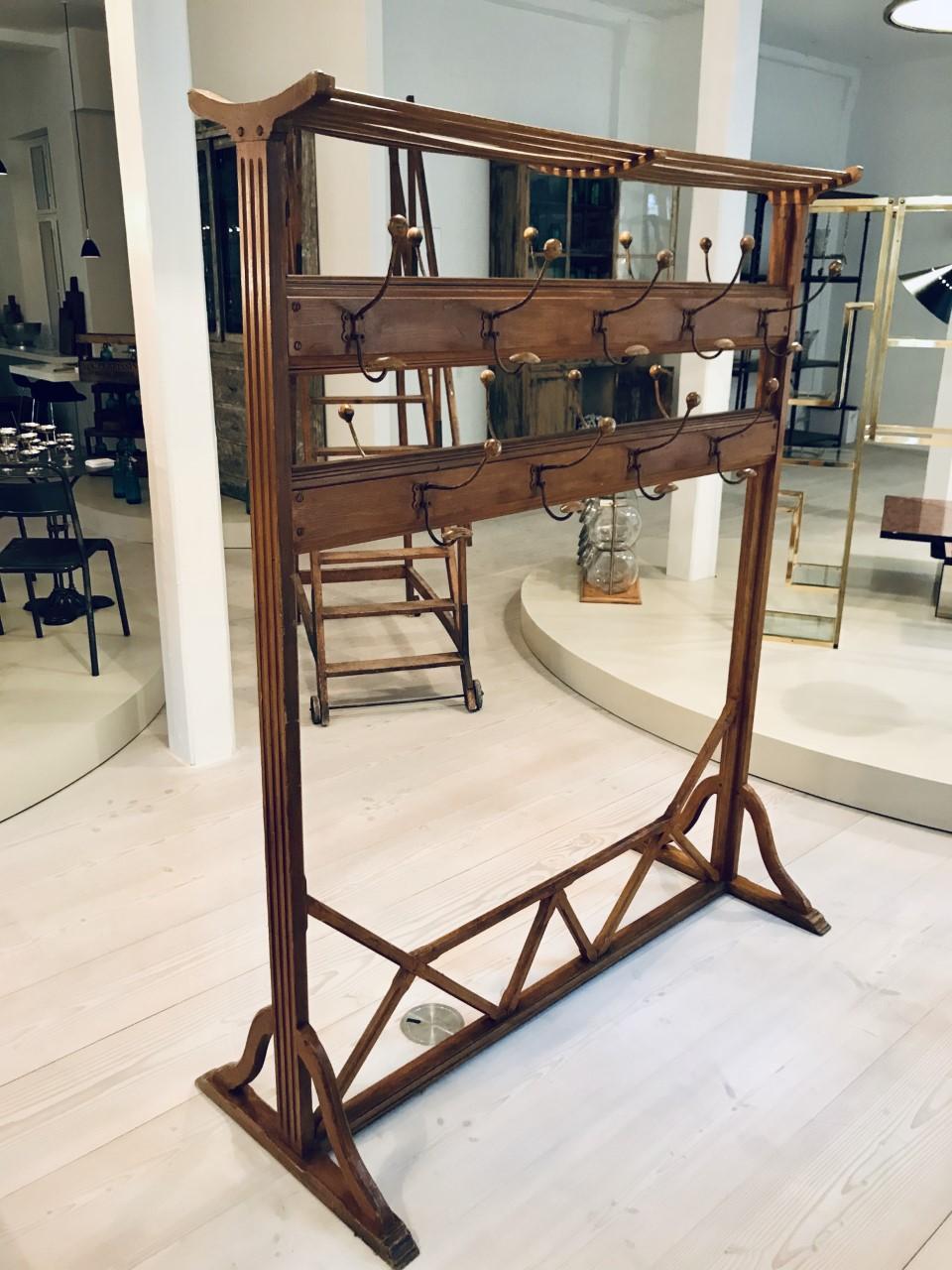Elegant antique freestanding wardrobe stand / clothes rack, from circa 1890s, France. Originally from a variety / pantomine theatre in Lyon. Handsome carpentry work and a quality stable. Painted in a beautiful warm burnt Sienna / brown hue. This