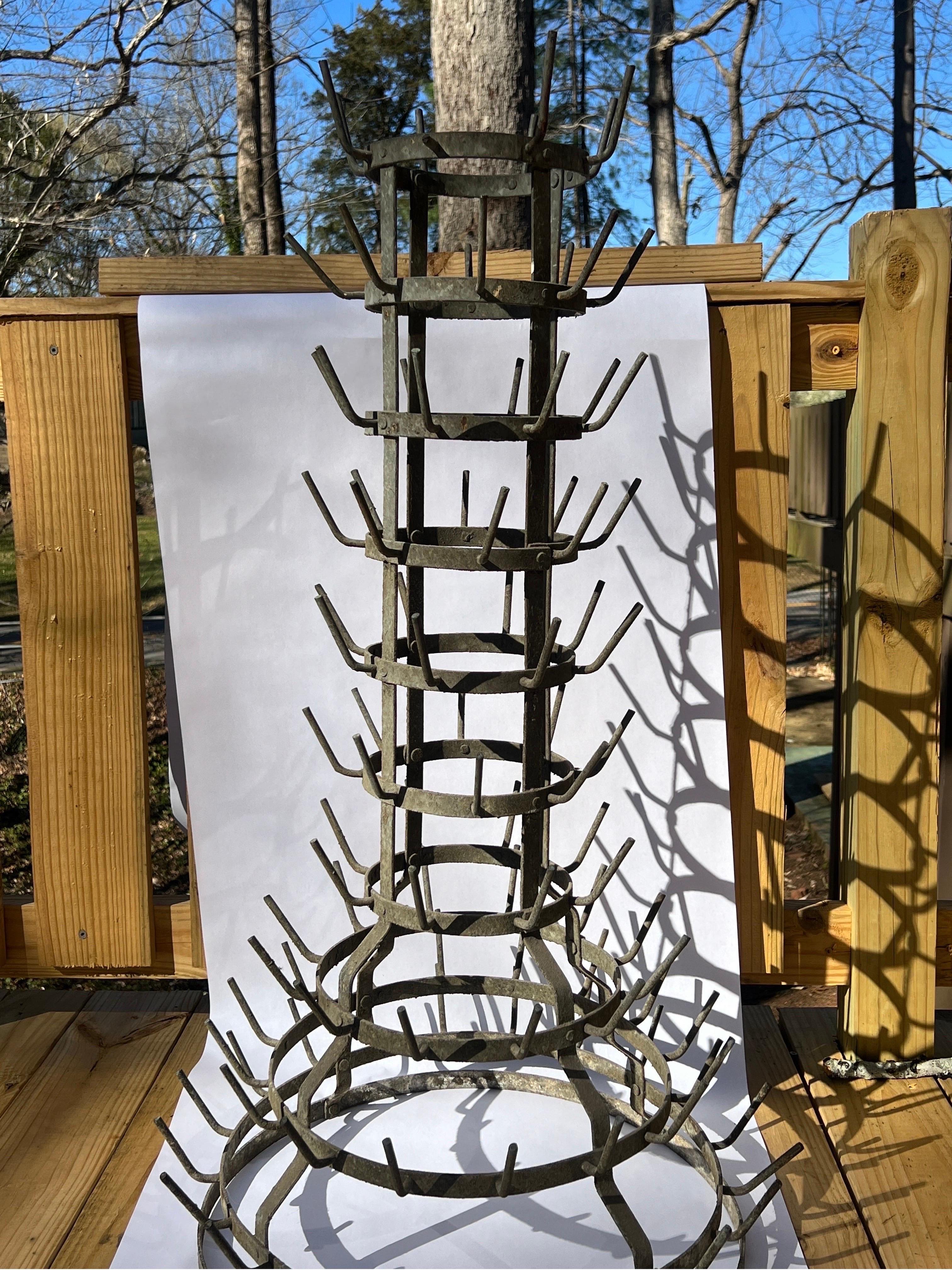 An antique french wine bottle drying rack. Made of zinc and constructed of 10 levels. No apparent marks.