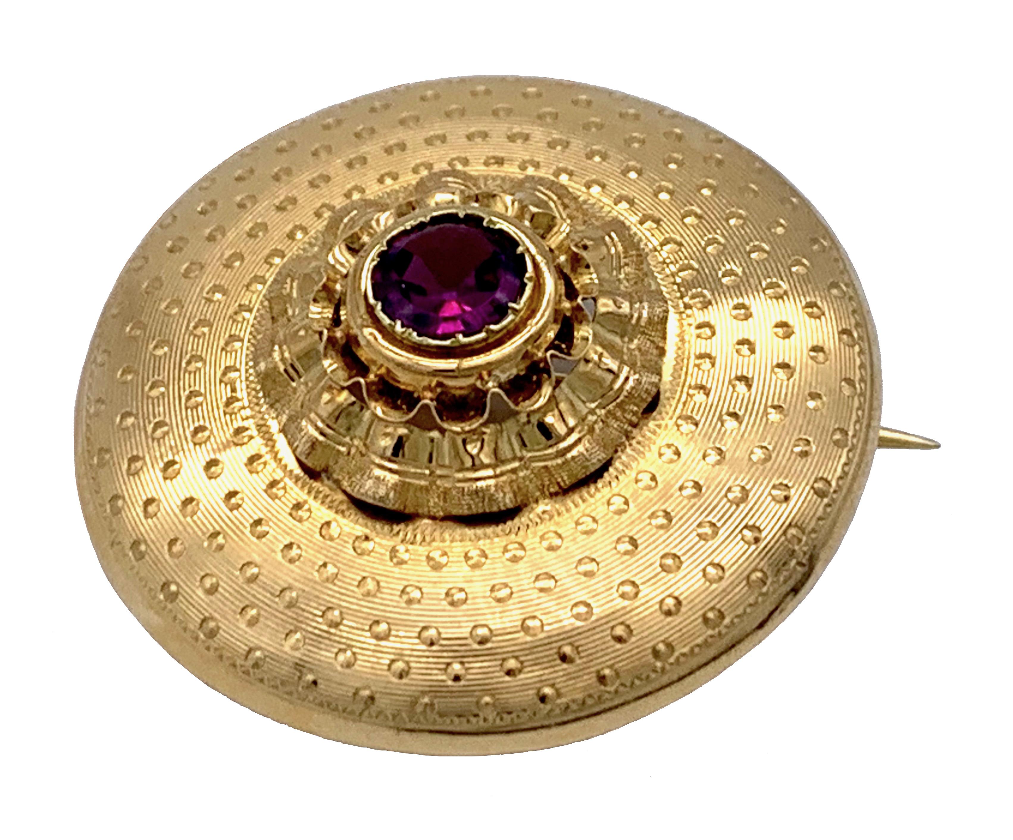 This magnificent target brooch is in truly wonderful condition and has been made out of 18 karat yellow gold by a French master goldsmith in 1865 ca. It is marked with a French maker's mark in a lozenge, the second initial being a B. The jewel is