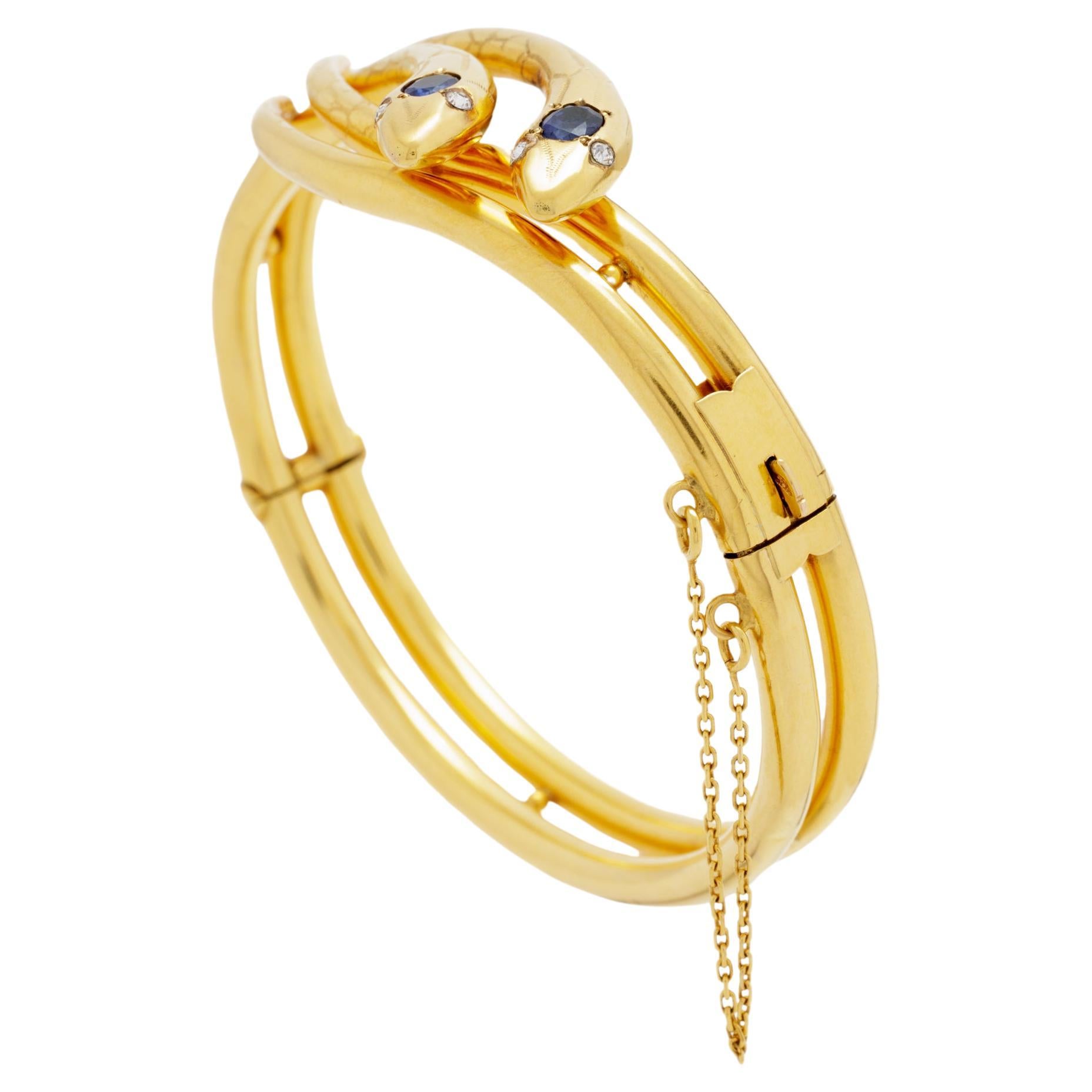 Bracelet ancien en or rose 18 carats, diamant et saphir à double serpent Bangle

Bien que cela puisse surprendre certains, le serpent est l'un des symboles les plus durables de l'amour éternel dans l'histoire. Les images d'Aphrodite ont longtemps