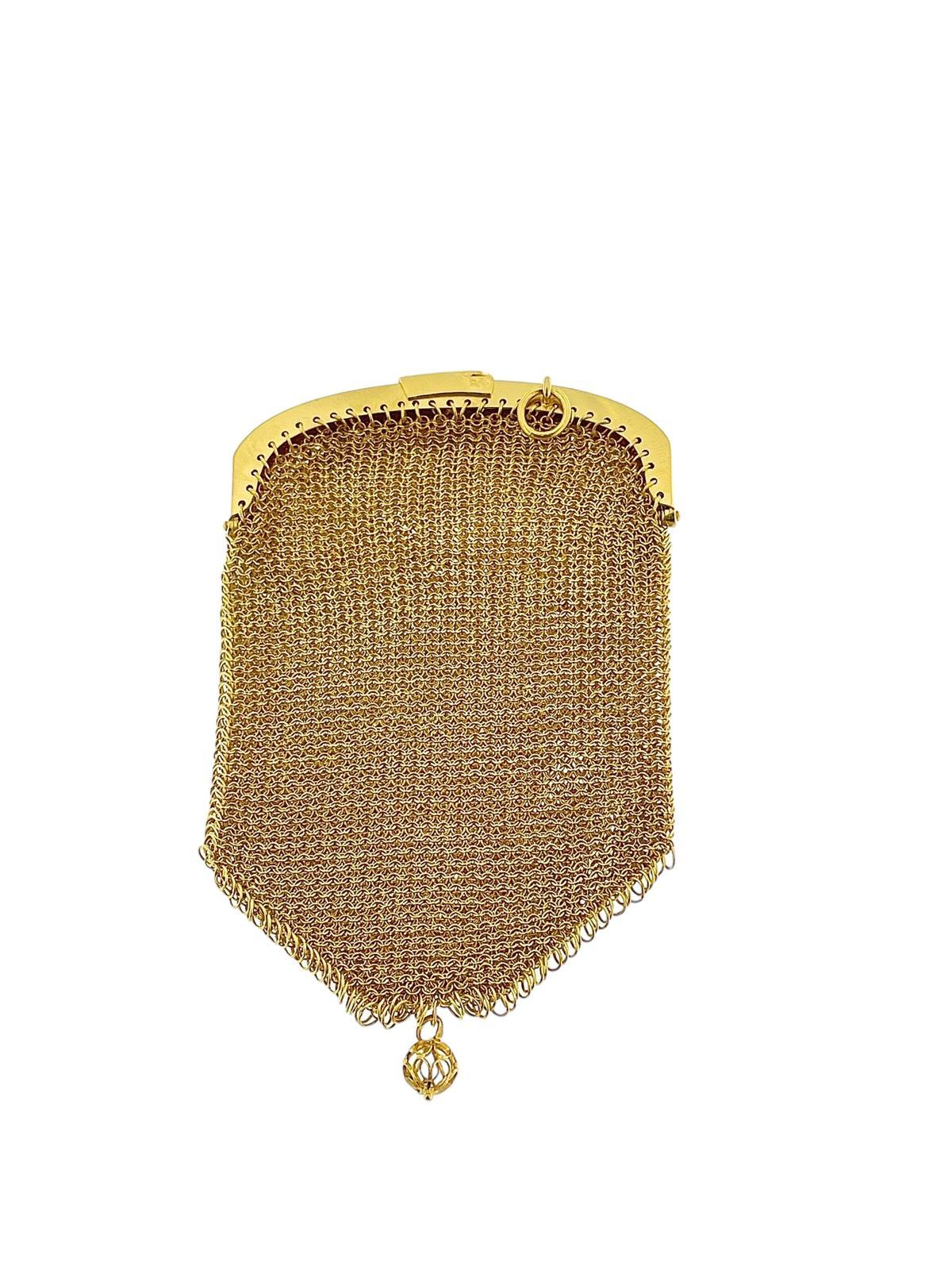 This Antique French 18 karat Yellow Gold Mesh Coin Purse Pendant is a charming and unique piece of jewelry with a rich history. Handcrafted with meticulous attention to detail, this pendant captures the elegance and craftsmanship of a bygone
