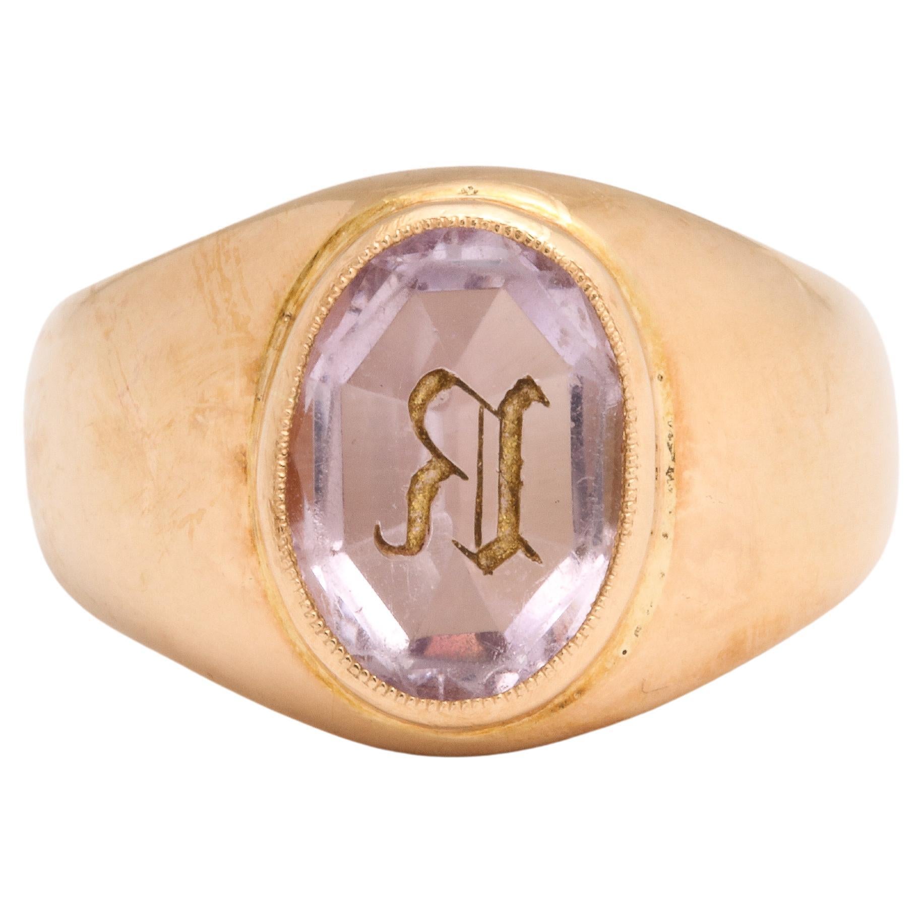 A pastel faceted amethyst is the central point of this French Victorian Gold Signet Ring and the reason it is so attractive. Rather than overshadow the rich gold it adds a flow of one to the other, a harmony. The gold is a rich buttery 18 kt. The