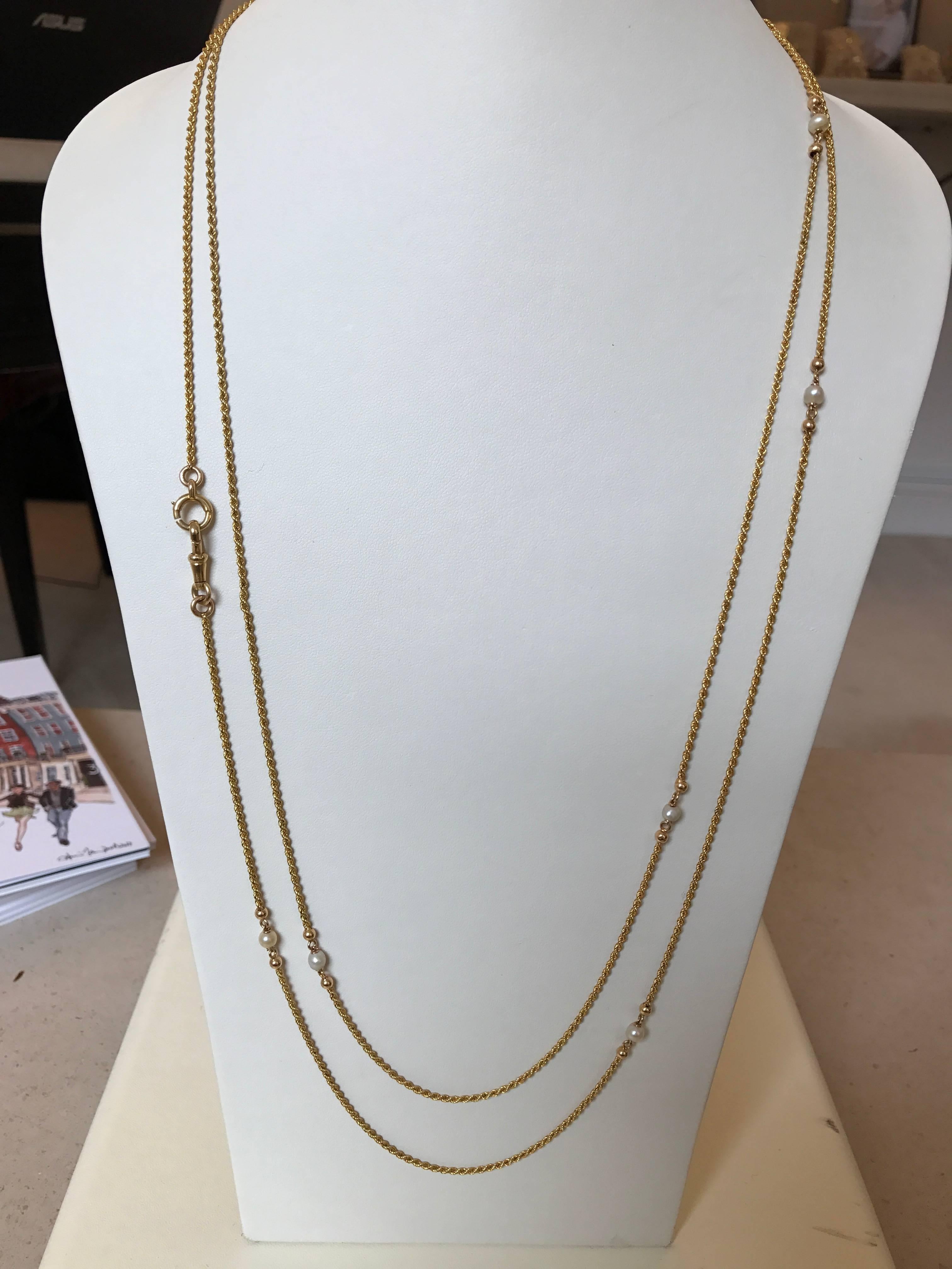 A charming 18ct yellow gold and natural pearl antique French long chain, made circa 1870

Length 150cms