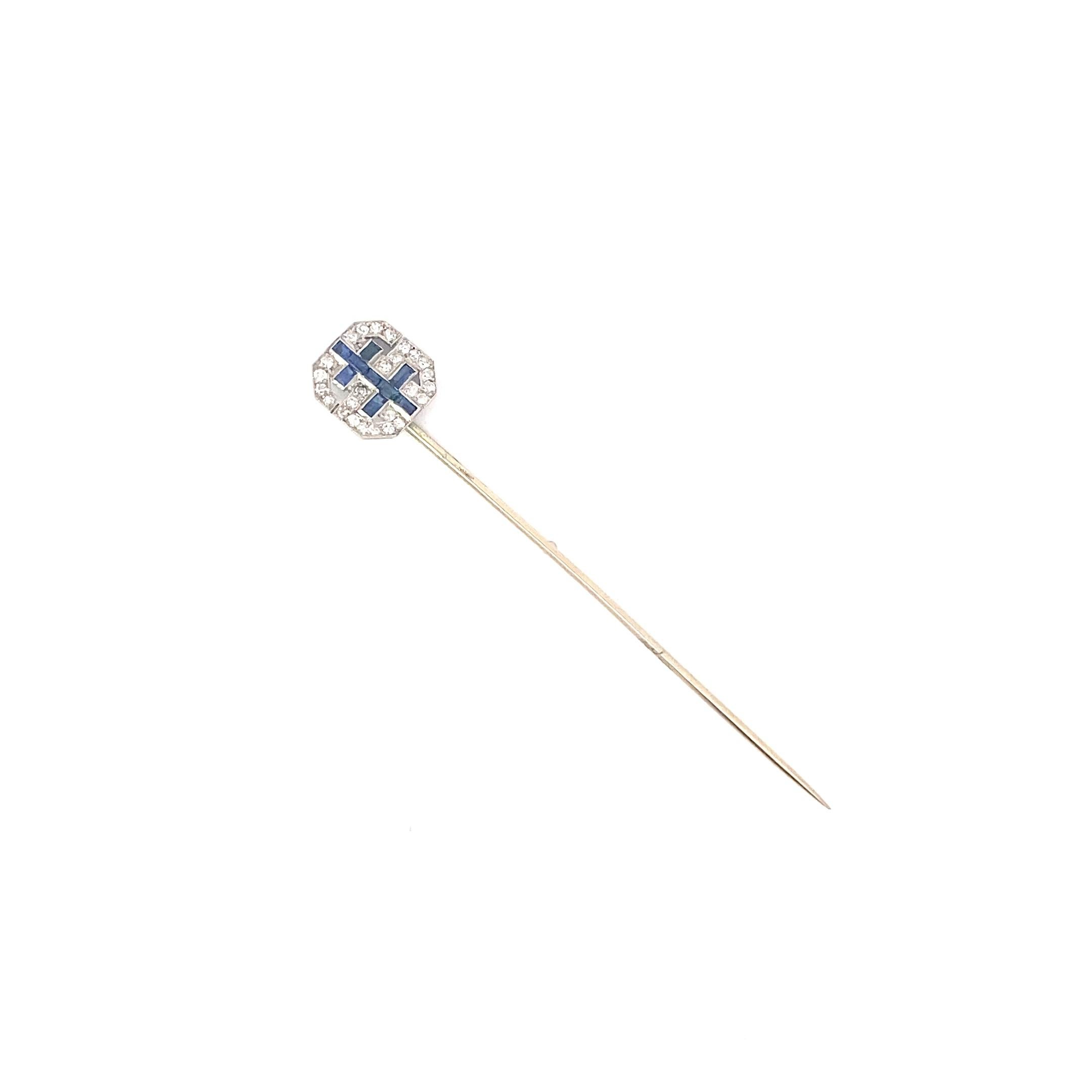 On of a Kind Stick Pin from the Early 20th century. The piece was crafted in 18k white gold featuring approximately 2.75 inches of pin for proper securing. The pave face of the pin features diamonds and sapphires in a double cross pattern. The face