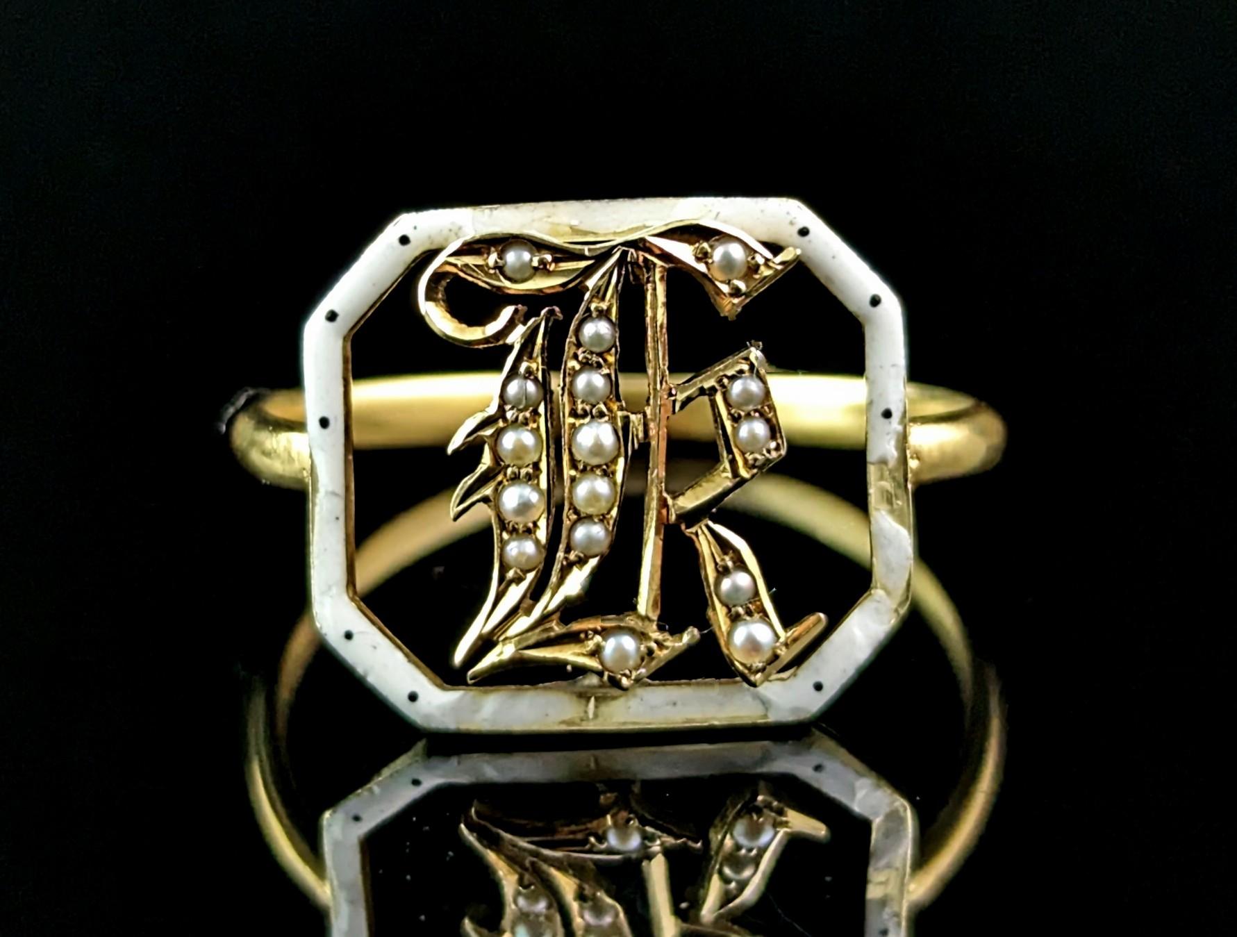 A wonderful antique conversion piece!

Crafted from a French 19th Century slider the fave is made up of the front of the slider, rich 18ct yellow gold with white and Black enamel detailing and a pearl set letter K to the centre, this could also work