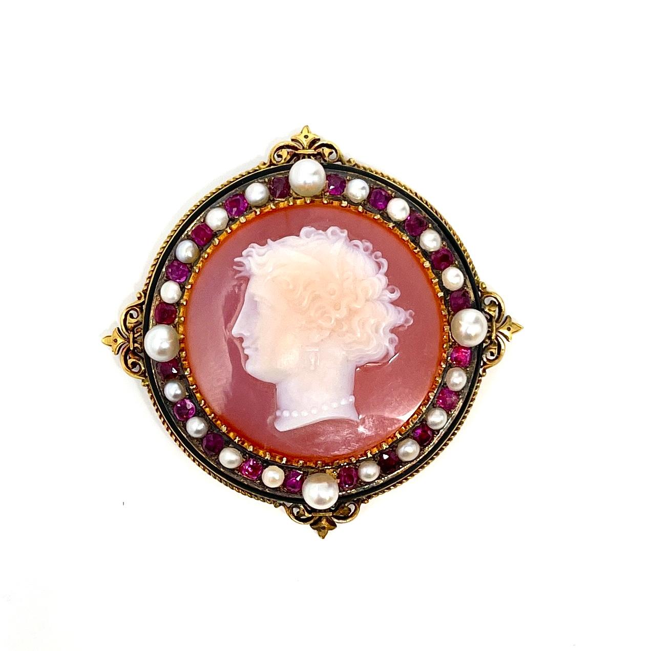 An exquisite 19th century French hardstone cameo suite in 18K gold, consisting of a necklace, bracelet, and earrings. The pendant can also be worn as a pin or mounted on the bangle.  It is in its original fitted box.

The bracelet measures 7/8