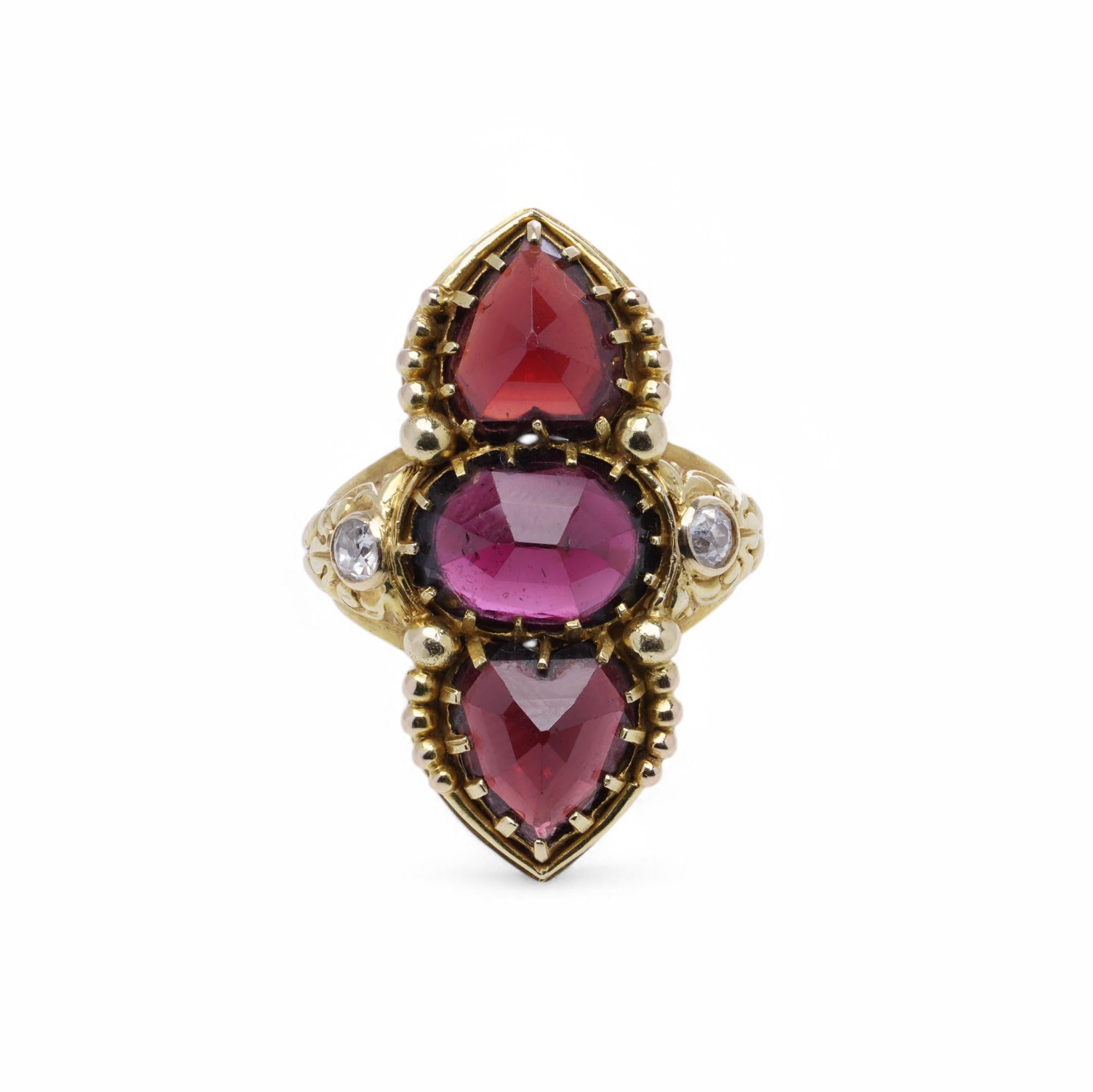 Antique French 18K gold navette-shaped ring featuring three rose-cut garnets and two old European-cut diamonds. The garnets are arranged in a vertical trilogy design, with two pear-shaped garnets framing a central oval garnet. The intricate gold