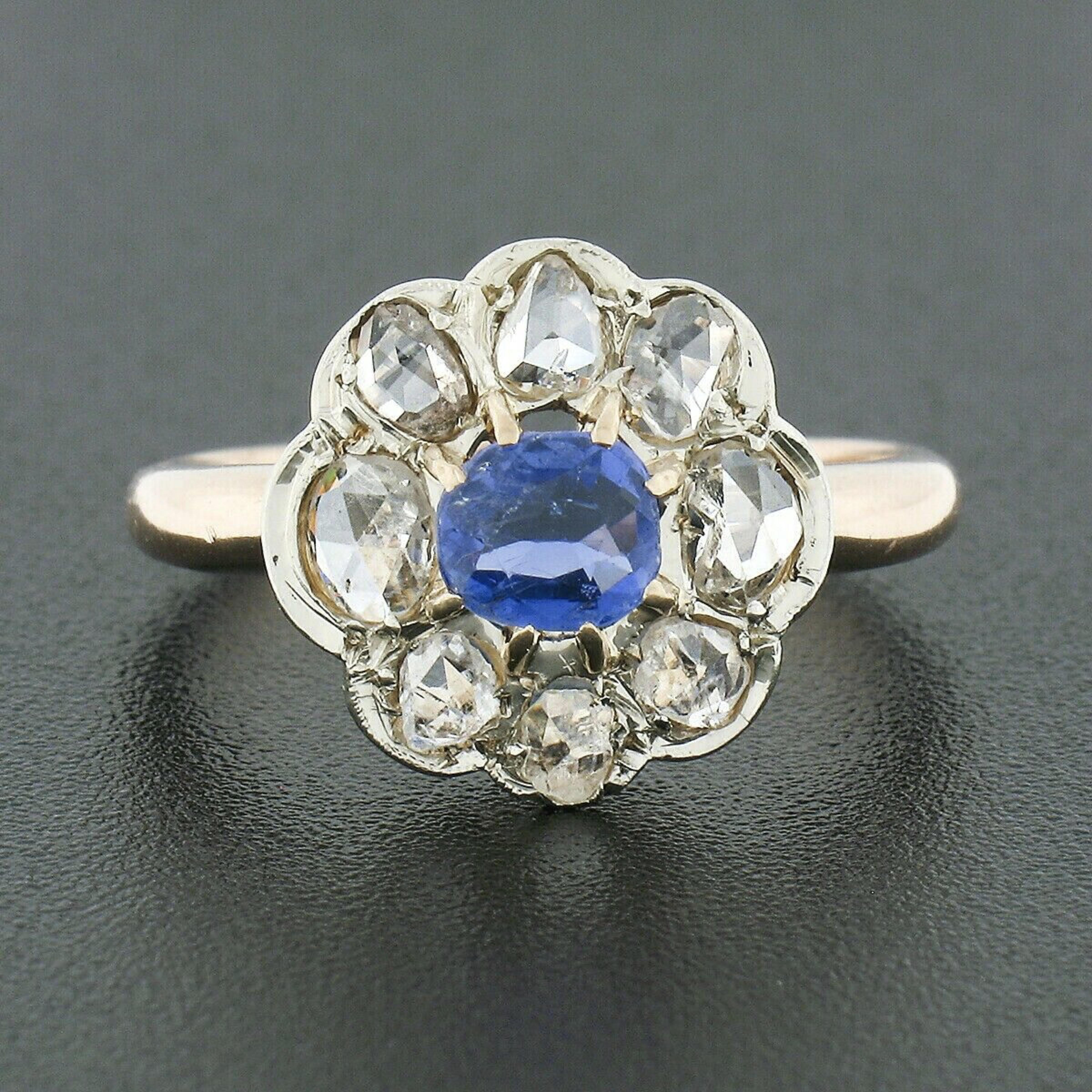 This truly breathtaking antique ring was crafted in France during the Victorian era from solid 18k gold. It features an elegant flower cluster design set with a, GIA certified, natural sapphire at its center. This gorgeous gemstone has an oval