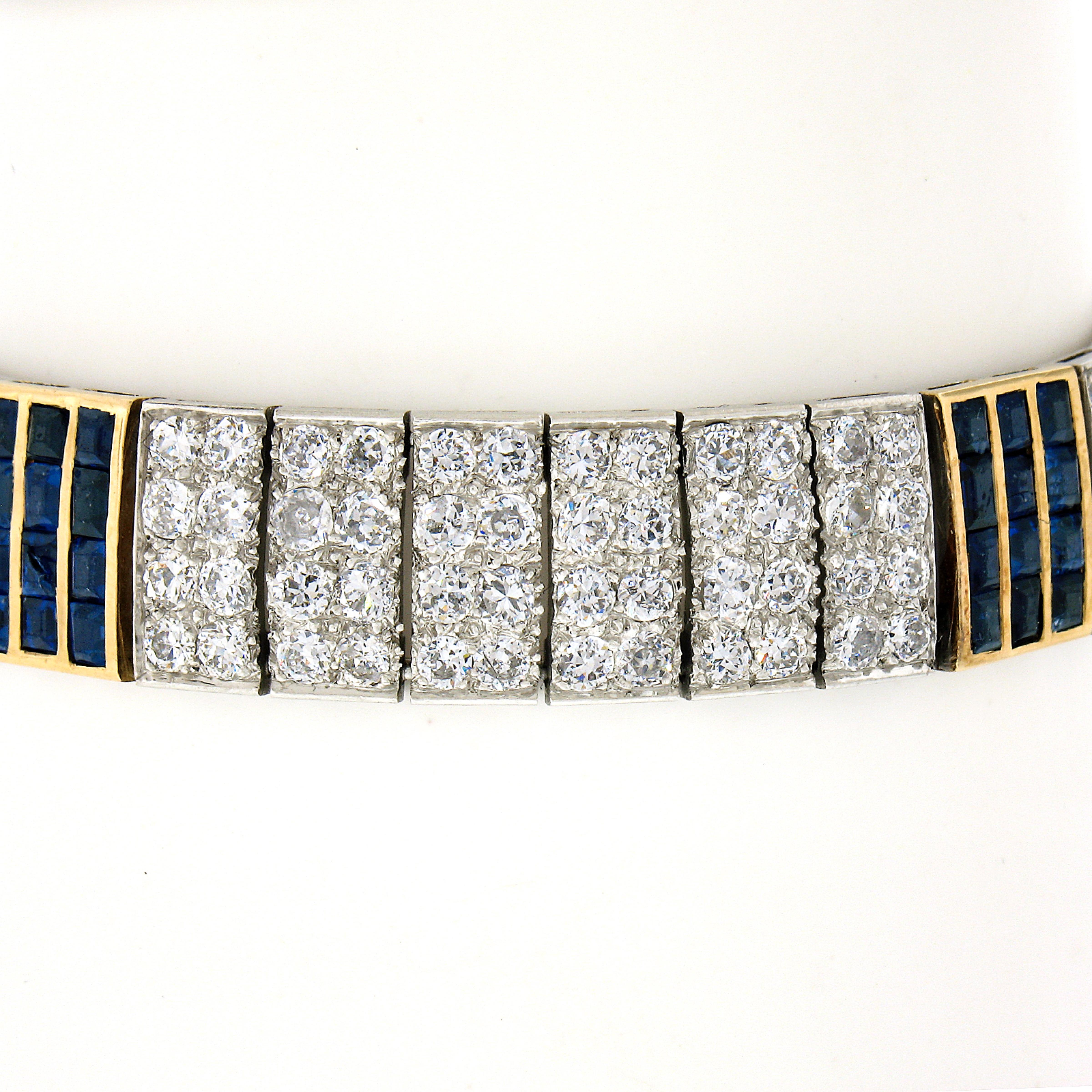 You are looking at an absolutely jaw dropping antique statement bracelet that was crafted in France from solid 18k yellow gold and platinum. This well made, wide, bracelet is constructed from rectangular links that are completely drenched in very