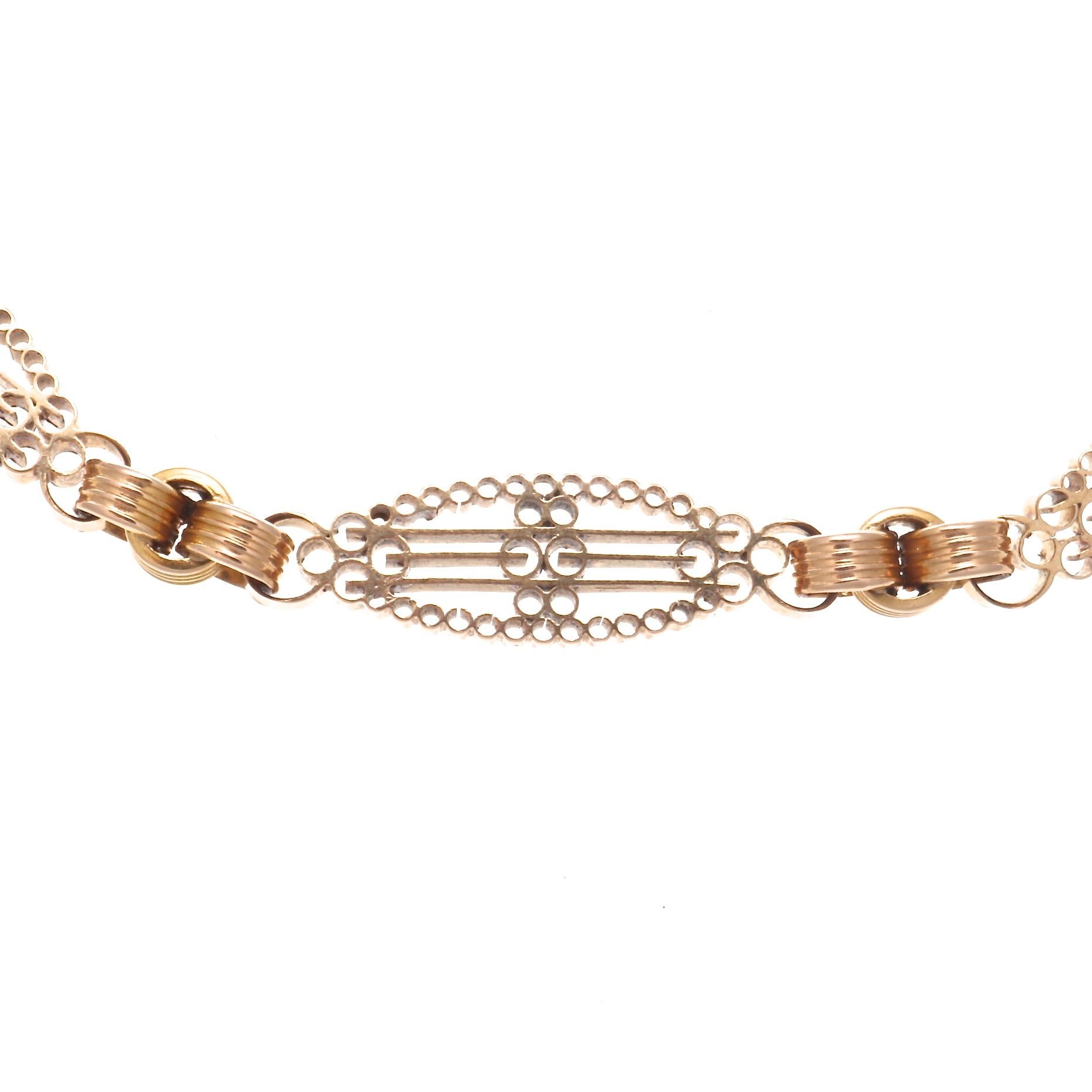 Found on an extensive trip through Southern France, this Antique French 18k rose gold necklace is a one of a kind find. At 17 inches long, it features seven intricately designed oval stations broken up by unique round links. 