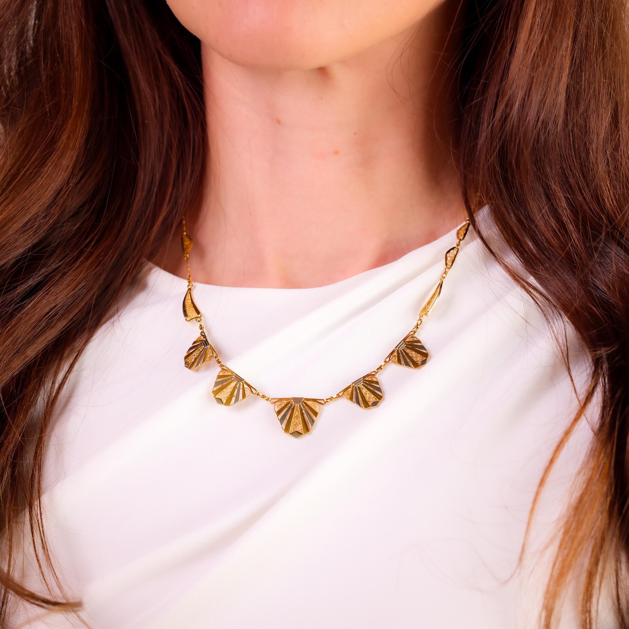 This antique French 18k gold chain necklace from the 1890s combines timeless elegance with classic craftsmanship in its dual-tone design.

Metal: 18k yellow and white gold 
Era: Antique 
Circa: 1890's 
Hallmarks: French eagle head and makers marks