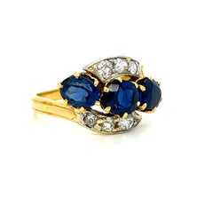 Antique French 18K Yellow Gold Diamond and Three Stone Sapphire ByPass Ring.