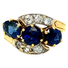 Antique French 18K Yellow Gold Diamond and Three Stone Sapphire ByPass Ring.