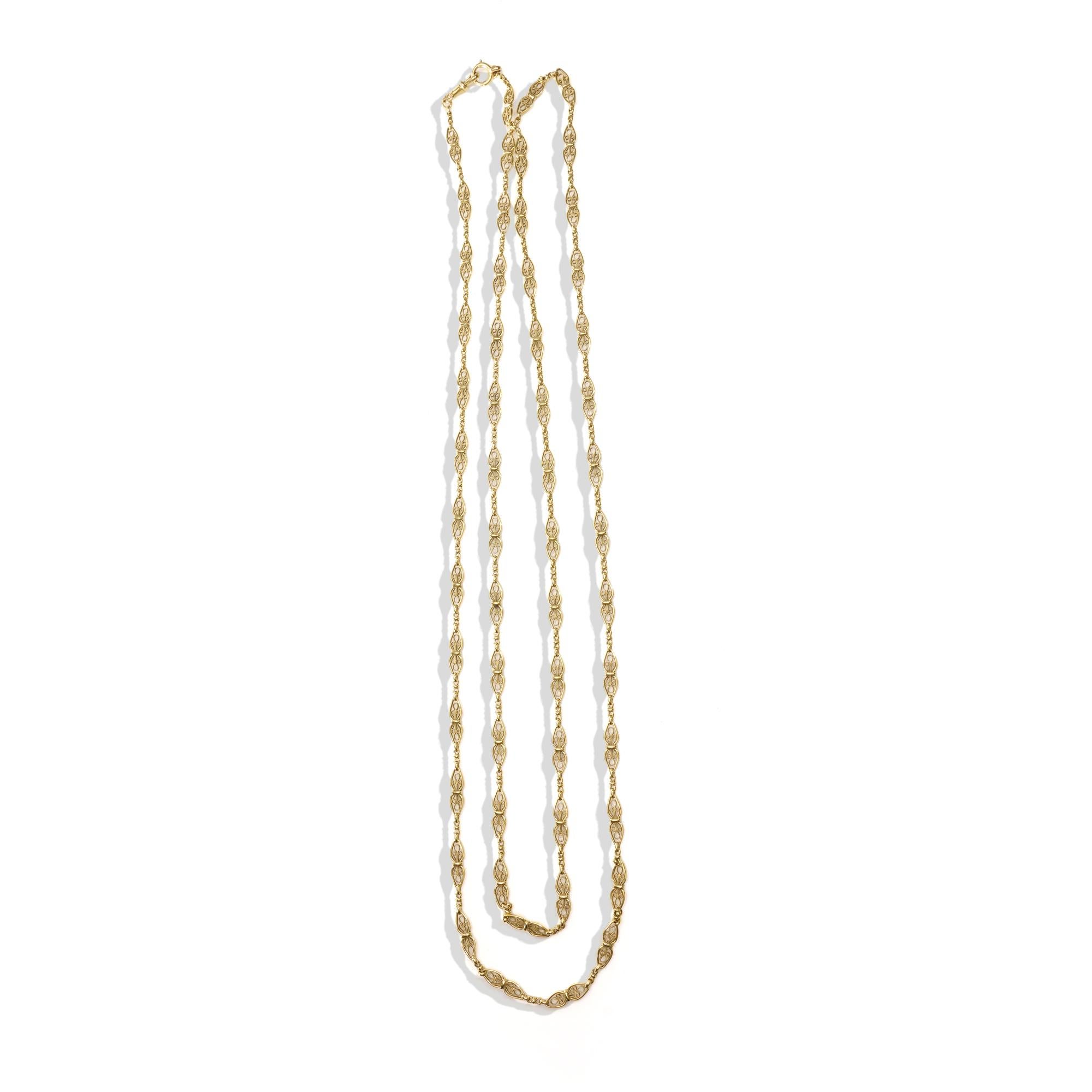 Indulge in the timeless elegance of this exquisite Antique French 18kt Yellow Gold Long Fancy Link Chain Necklace. Crafted in the 19th century, circa 1838-1847, in France, this stunning piece showcases the unparalleled craftsmanship of the