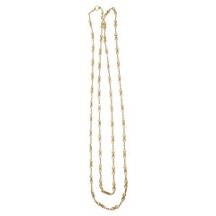 Long collier français ancien à maillons fantaisie en or jaune 18 carats