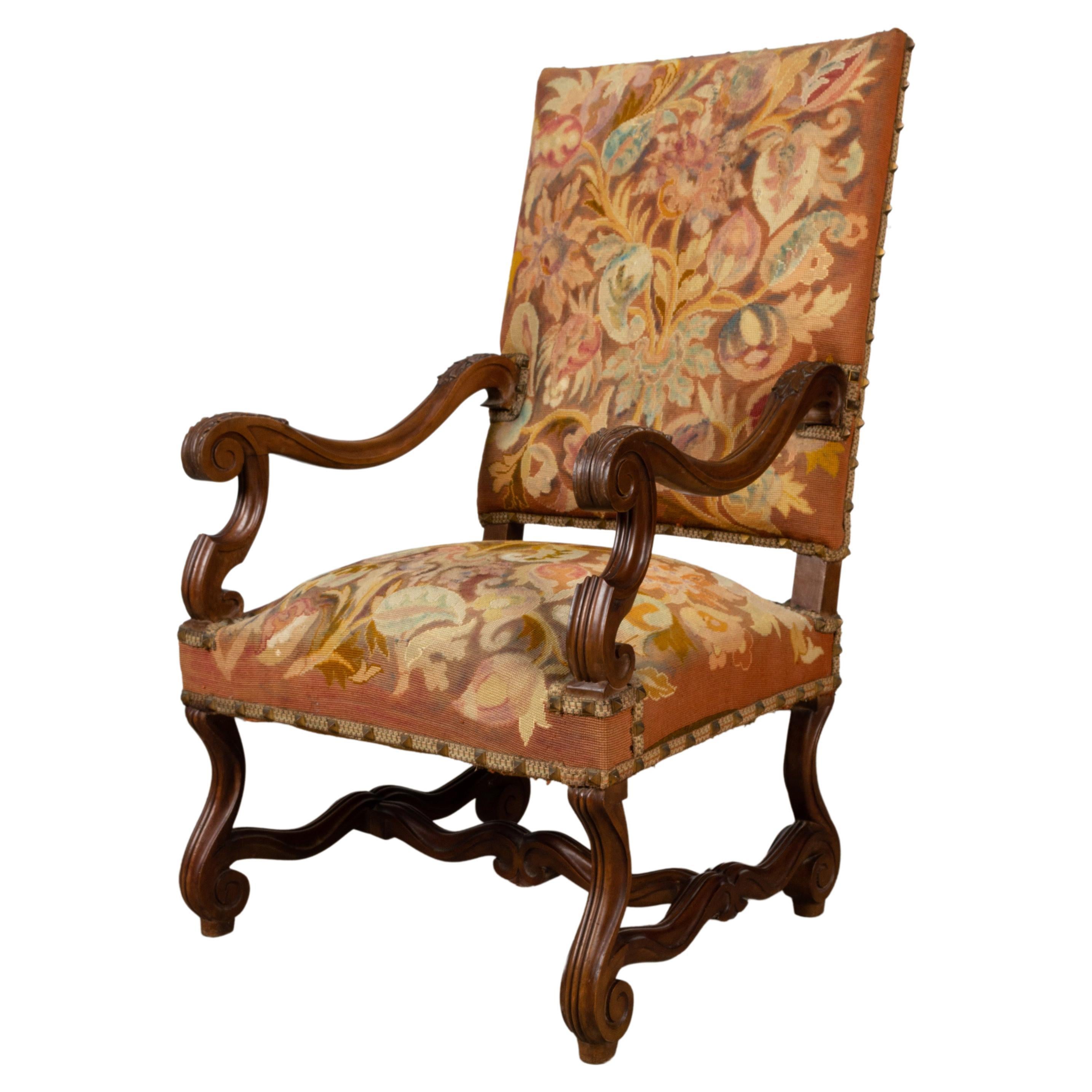 Antique French 18th century Walnut Elbow Fauteuil armchair, circa 1720

A French 18th century carved walnut armchair upholstered in gros point needlework, with acanthus carved decoration to the scrolling arms and legs and with pointed brass bosses