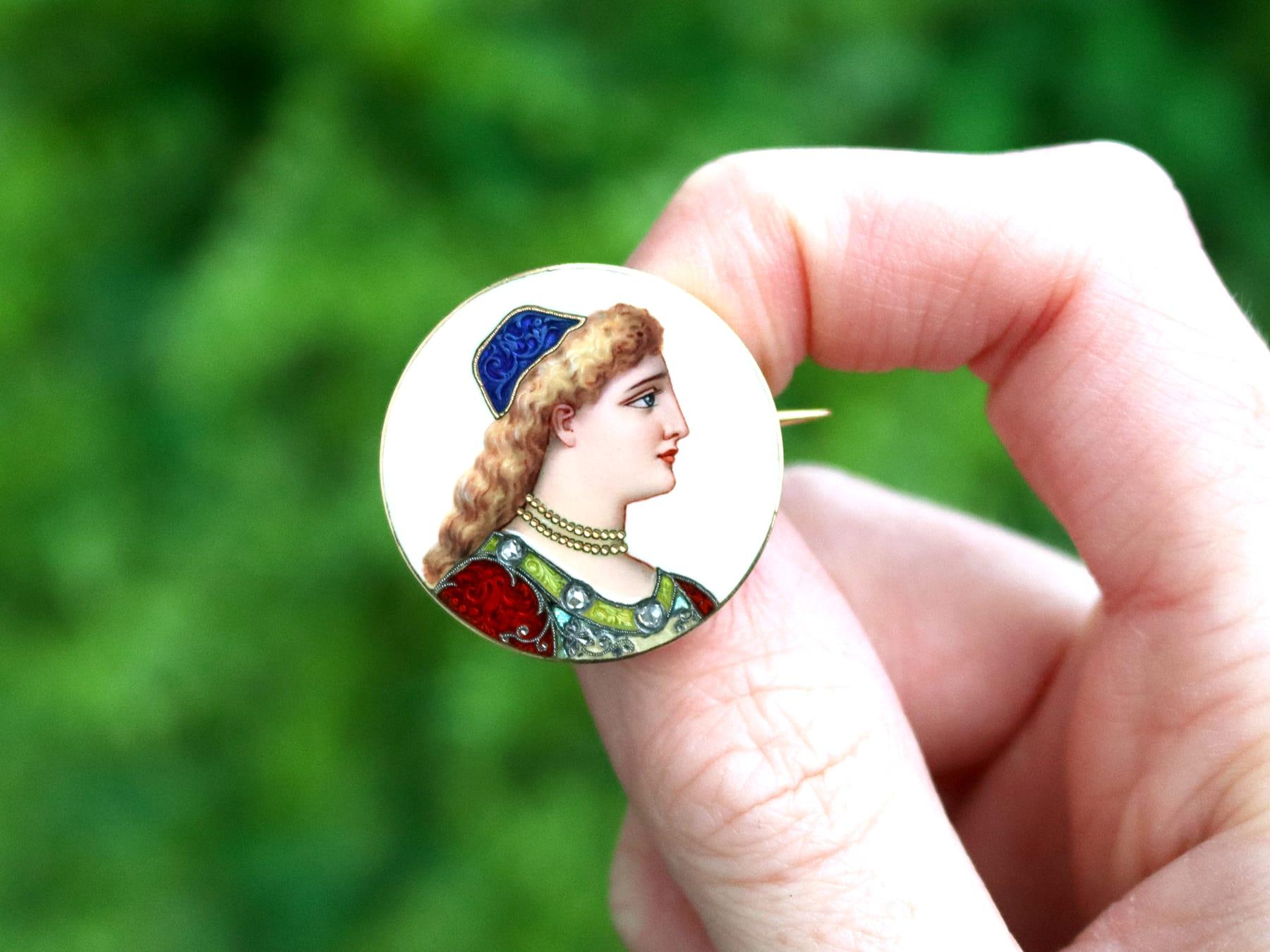 A fine and impressive antique French hand painted enamel and 18k yellow gold brooch; part of our diverse antique jewelry and estate jewelry collections.

This fine and impressive antique enamel brooch has been crafted in 18k yellow gold.

The