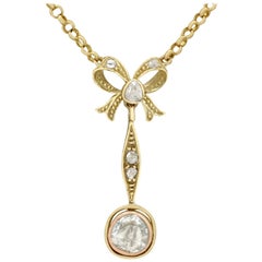 Antique French, 1910s 1.15 Carat Diamond Yellow Gold Bow Pendant