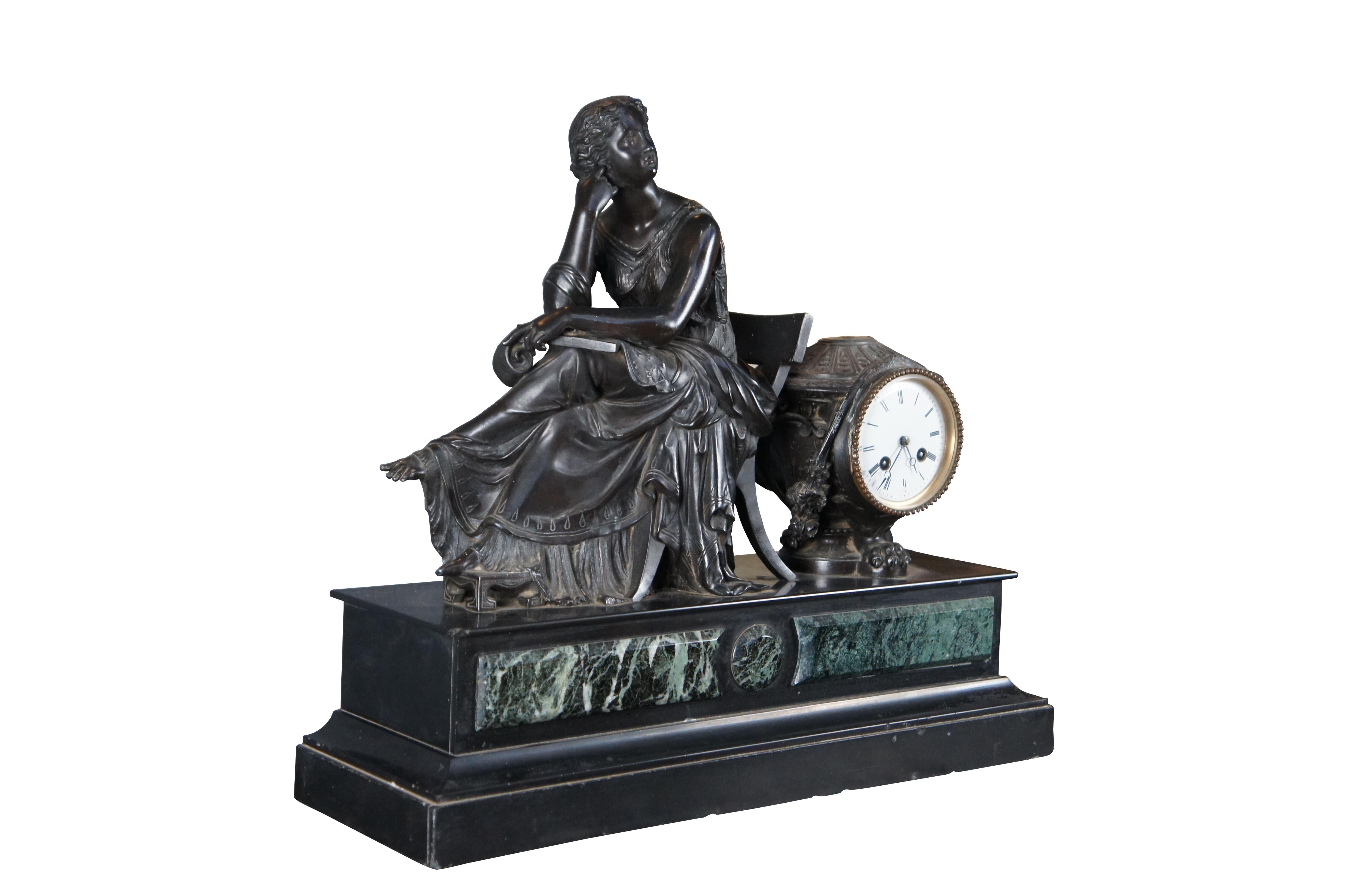 A beautiful 19th Century French Mantel Clock. Features a seated woman in the thinker position. She is wearing a large flowing dress, sitting on a Klismos chair with footed raised over a stool. Behind the figure is the clock houses in an ornate urn