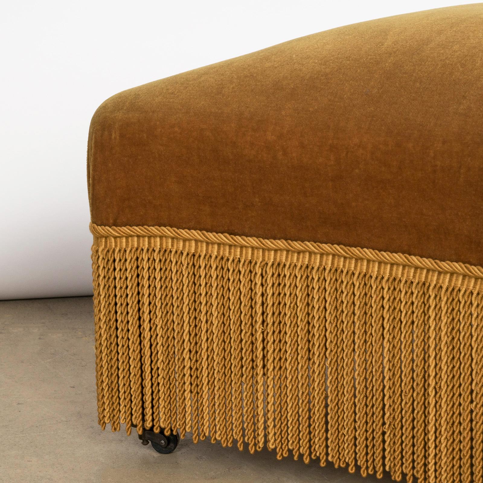 Delight in the charm of this French 19th-century Napoleon III style stool or foot bench, featuring an elegant mustard velvet upholstery.

The vintage velvet upholstery has been cleaned and remains in great condition. While we appreciate the allure