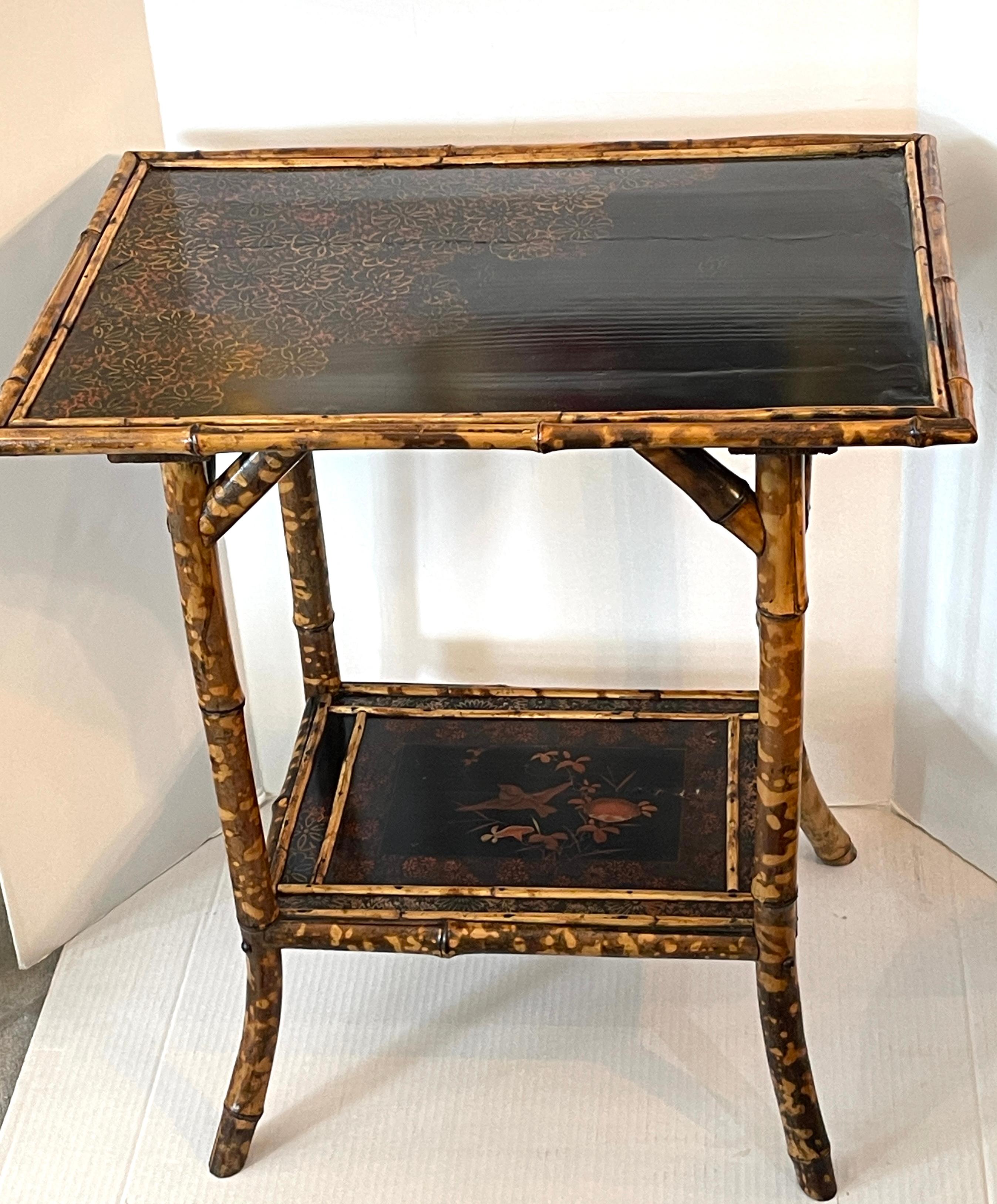 Just arrive!
This is wonderful example of a French Antique 19Th. C. Tortoiseshell Bamboo & Lacquer side table from the Aesthetic Movement or Art-Nouveau period.
This table has two tiers with each a lacquer plateau.
The bottom one has birds and