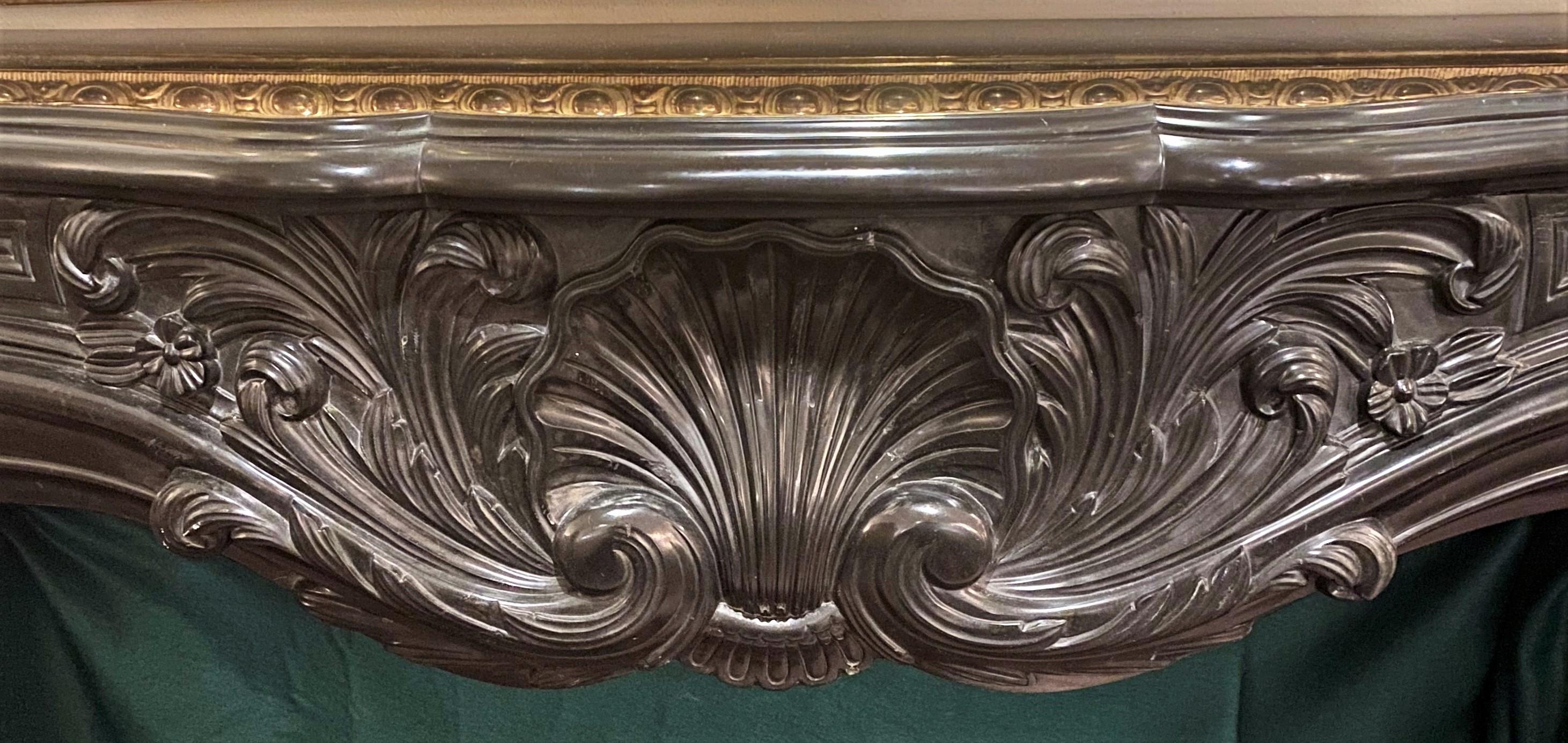 Antique French 19th Century Carved Black Marble Mantel In Good Condition In New Orleans, LA