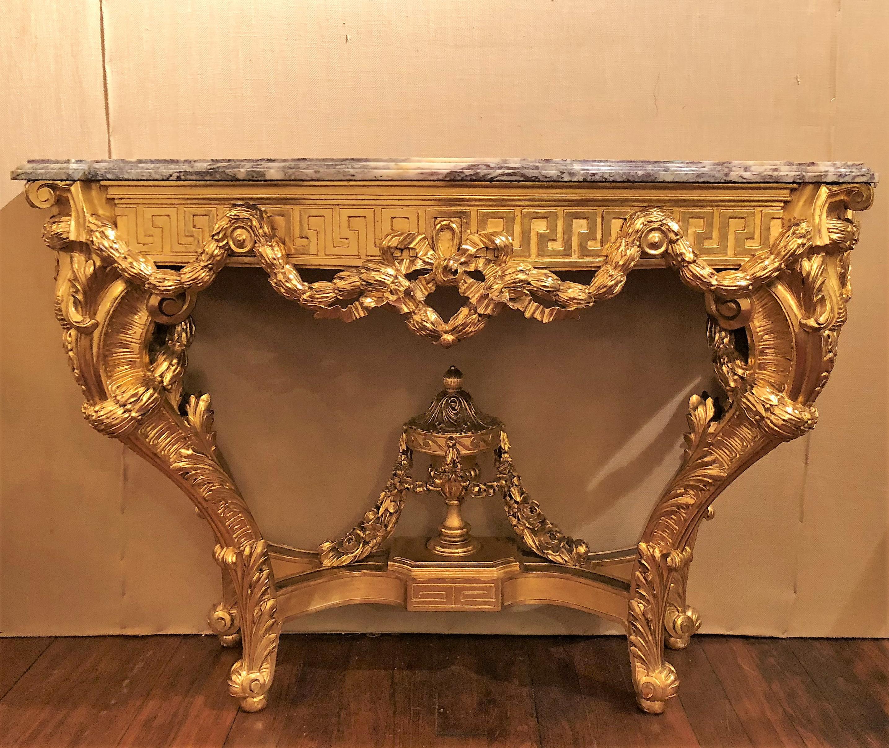 Antique French 19th century gold leaf console with marble top.